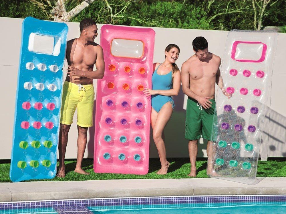 Three people holding colorful Bestway inflatable pool mattresses with windows by a poolside