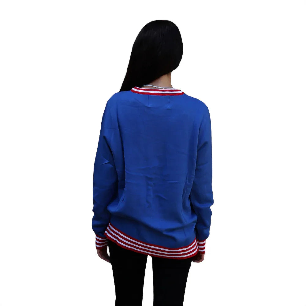 Woman in blue varsity jacket with red and white striped collar and cuffs, back view