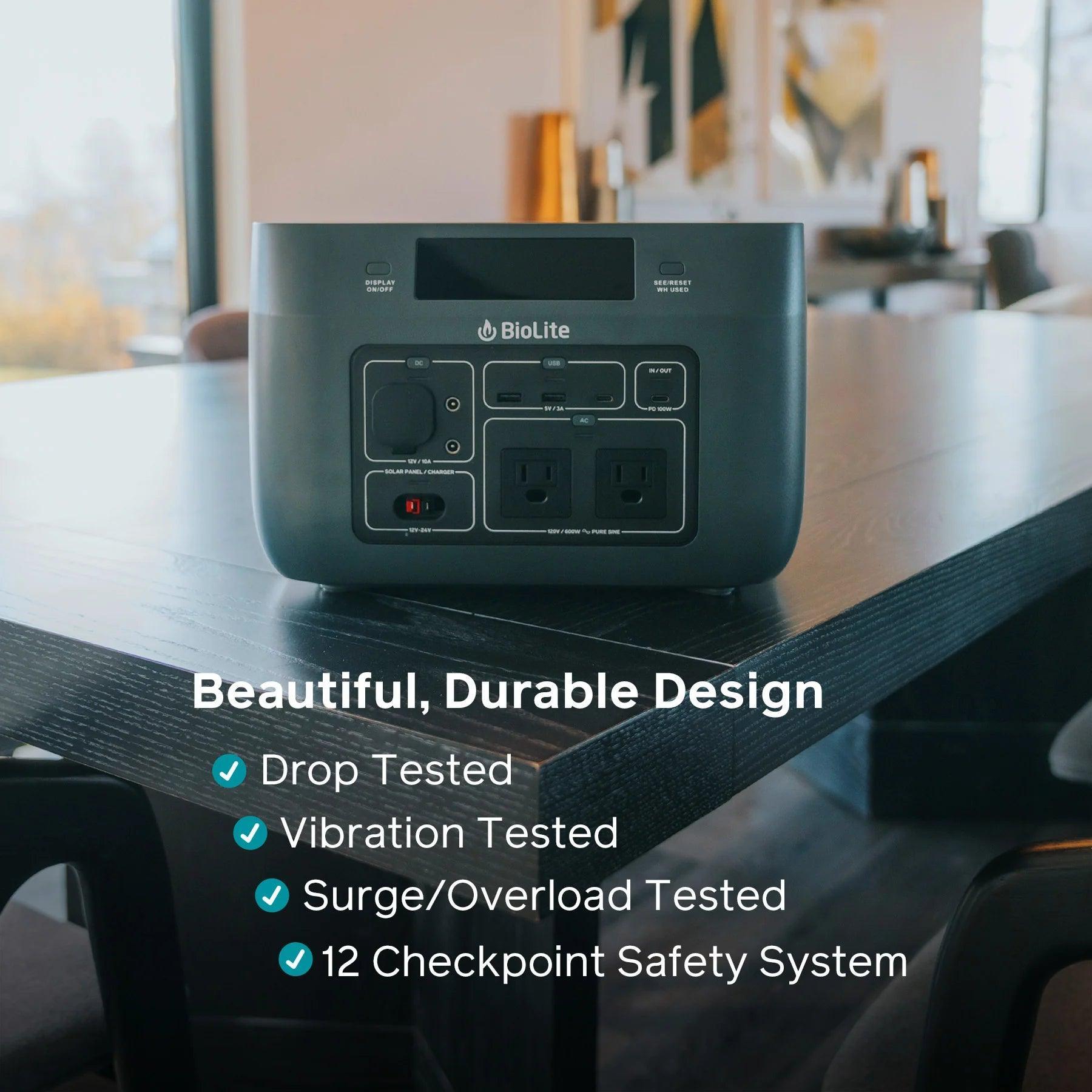 BioLite BaseCharge 600 portable power station on table, safety features text overlay