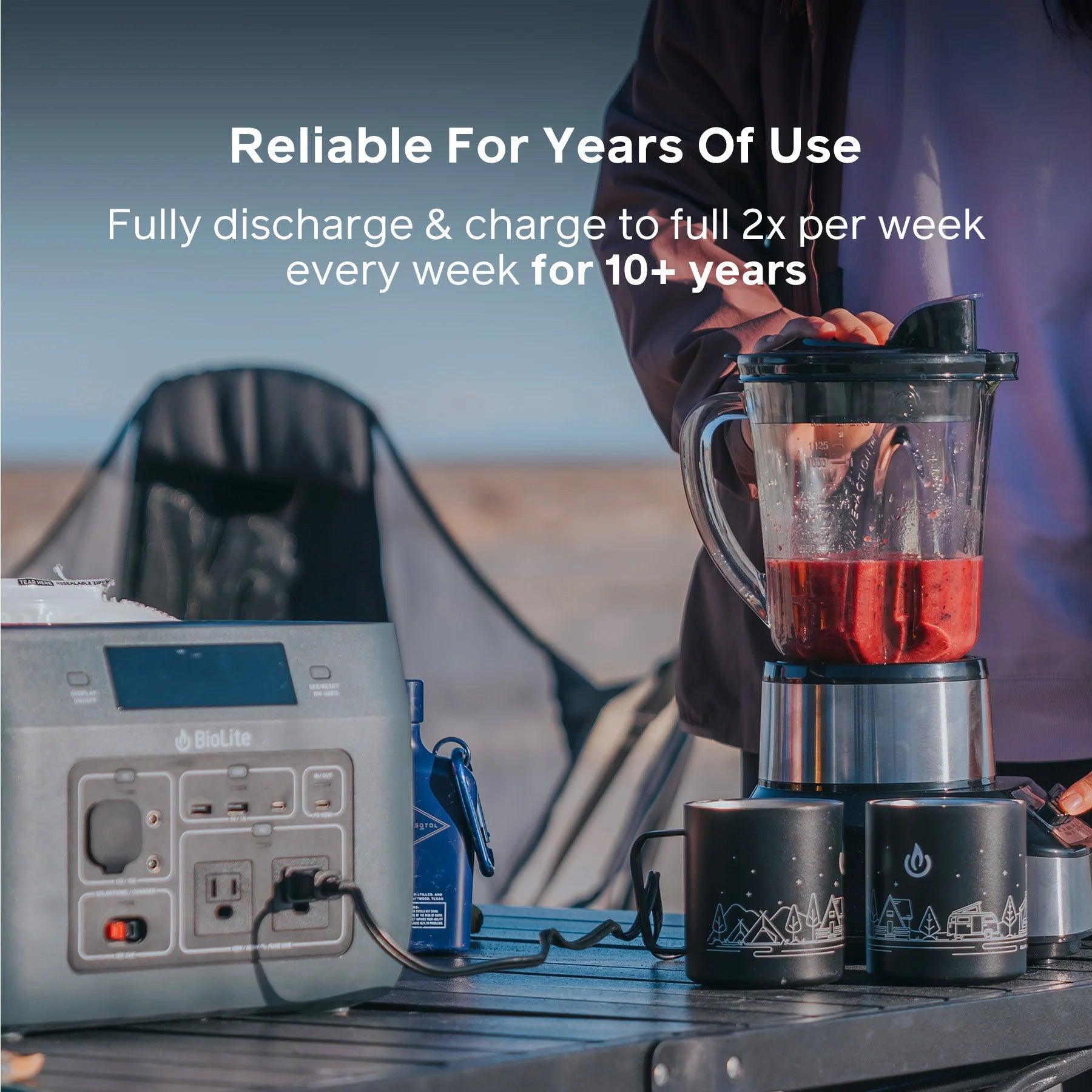 BioLite BaseCharge 600 portable power station powering a blender outdoors on a picnic table