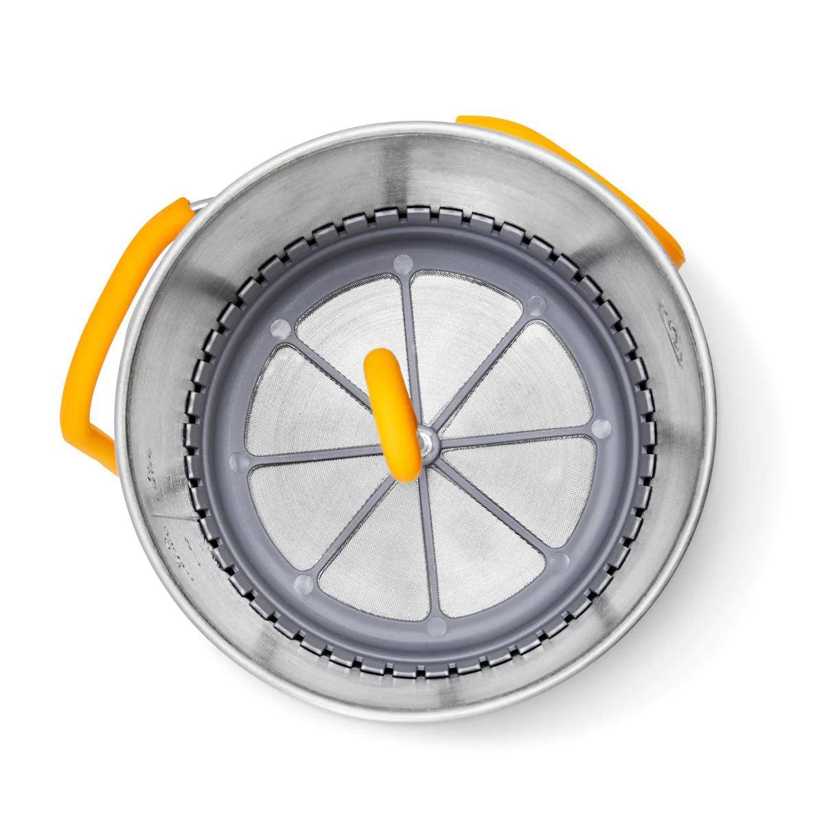 Top view of Biolite CampStove KettlePot with coffee press and yellow handles