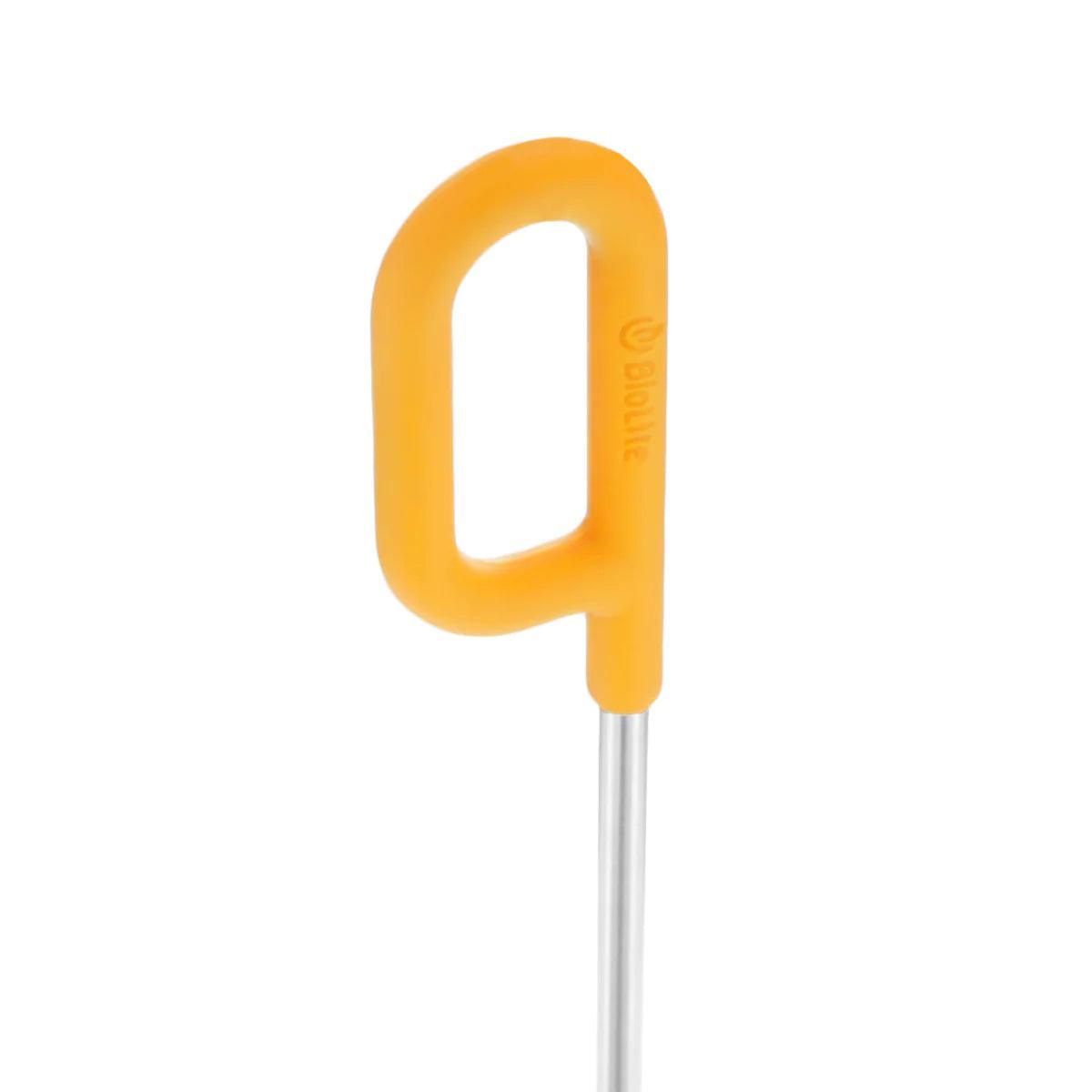 BioLite fire poker with yellow handle and metal rod on white background