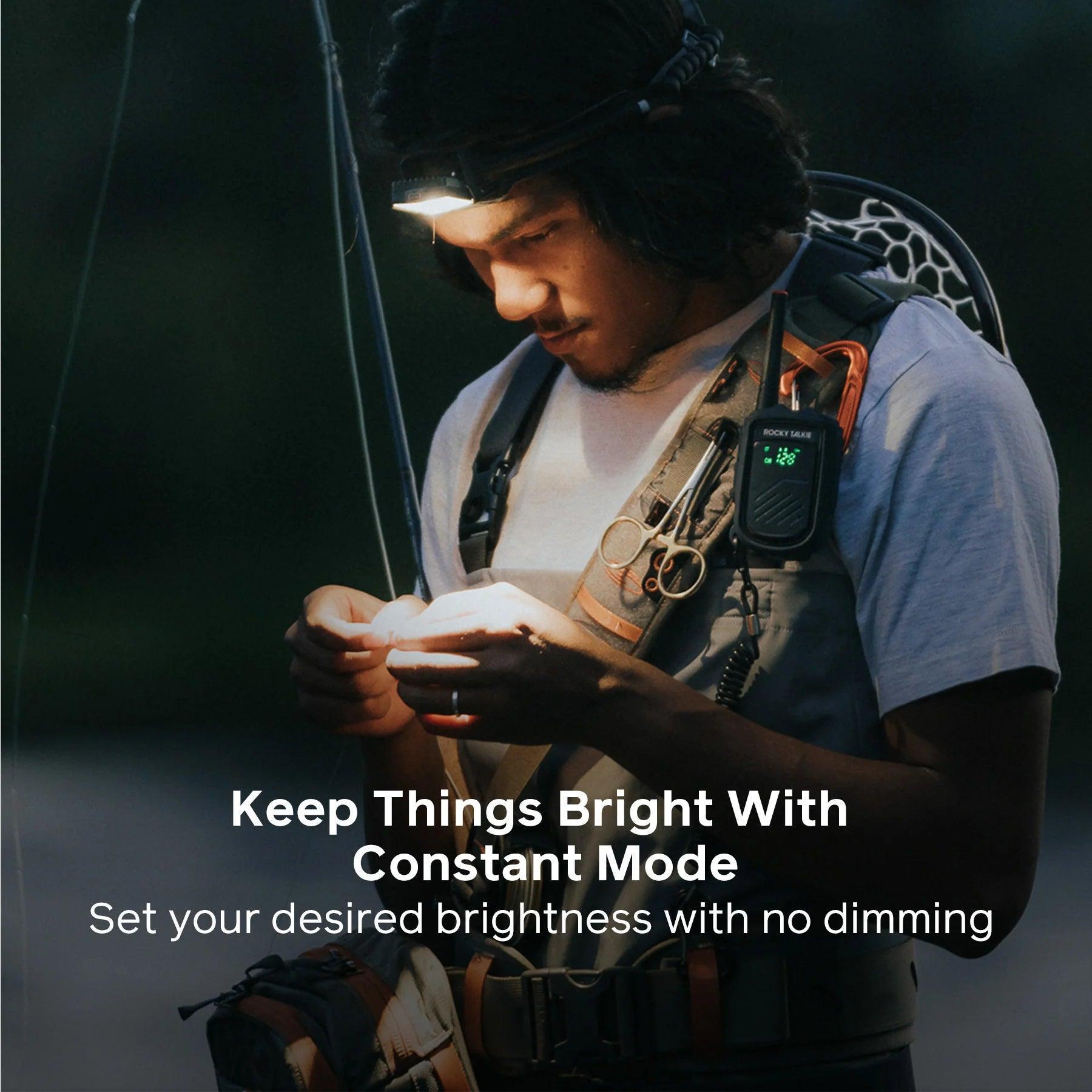 Man using BioLite HeadLamp 800 Pro while fishing outdoors, wearing fishing gear and radio.