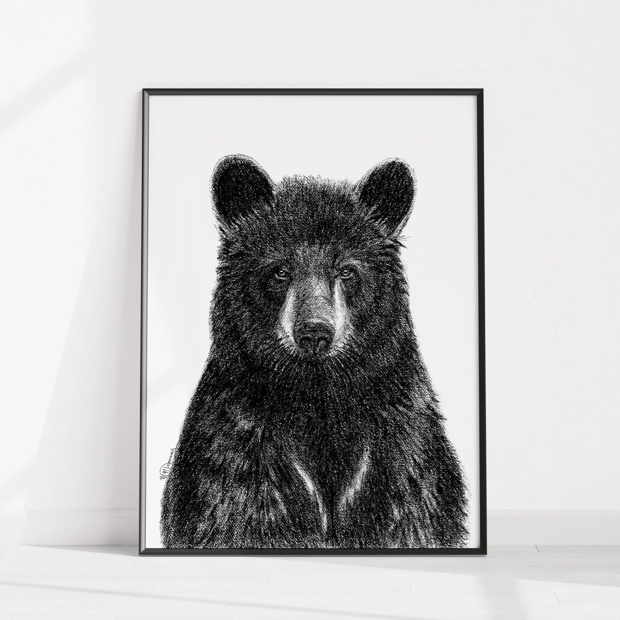 Framed black bear portrait illustration on white wall, minimalist animal art print