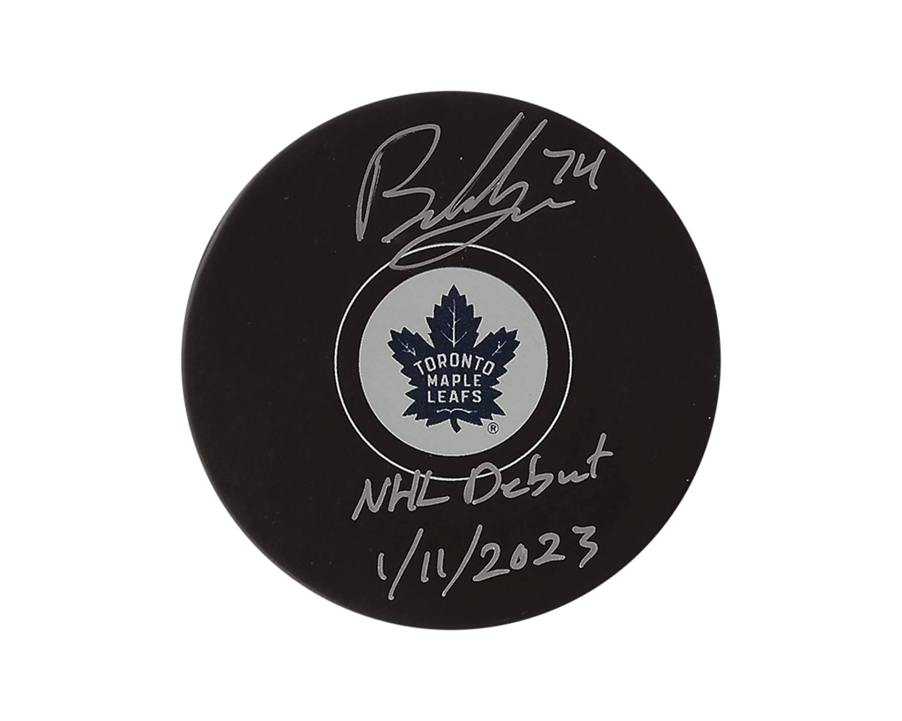 Toronto Maple Leafs signed hockey puck with NHL debut inscription, January 11, 2023