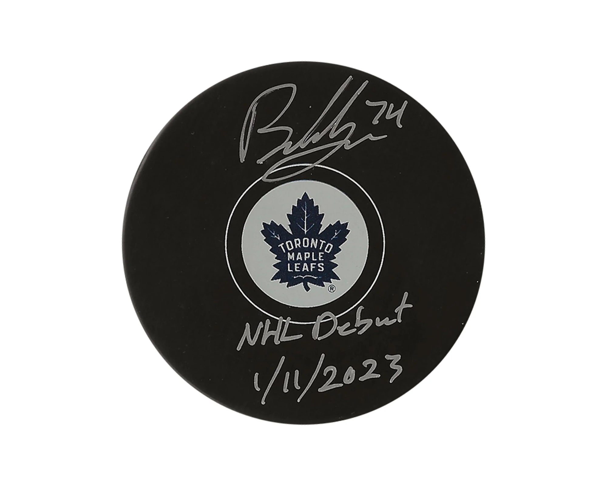 Toronto Maple Leafs signed hockey puck with NHL debut inscription, January 11, 2023