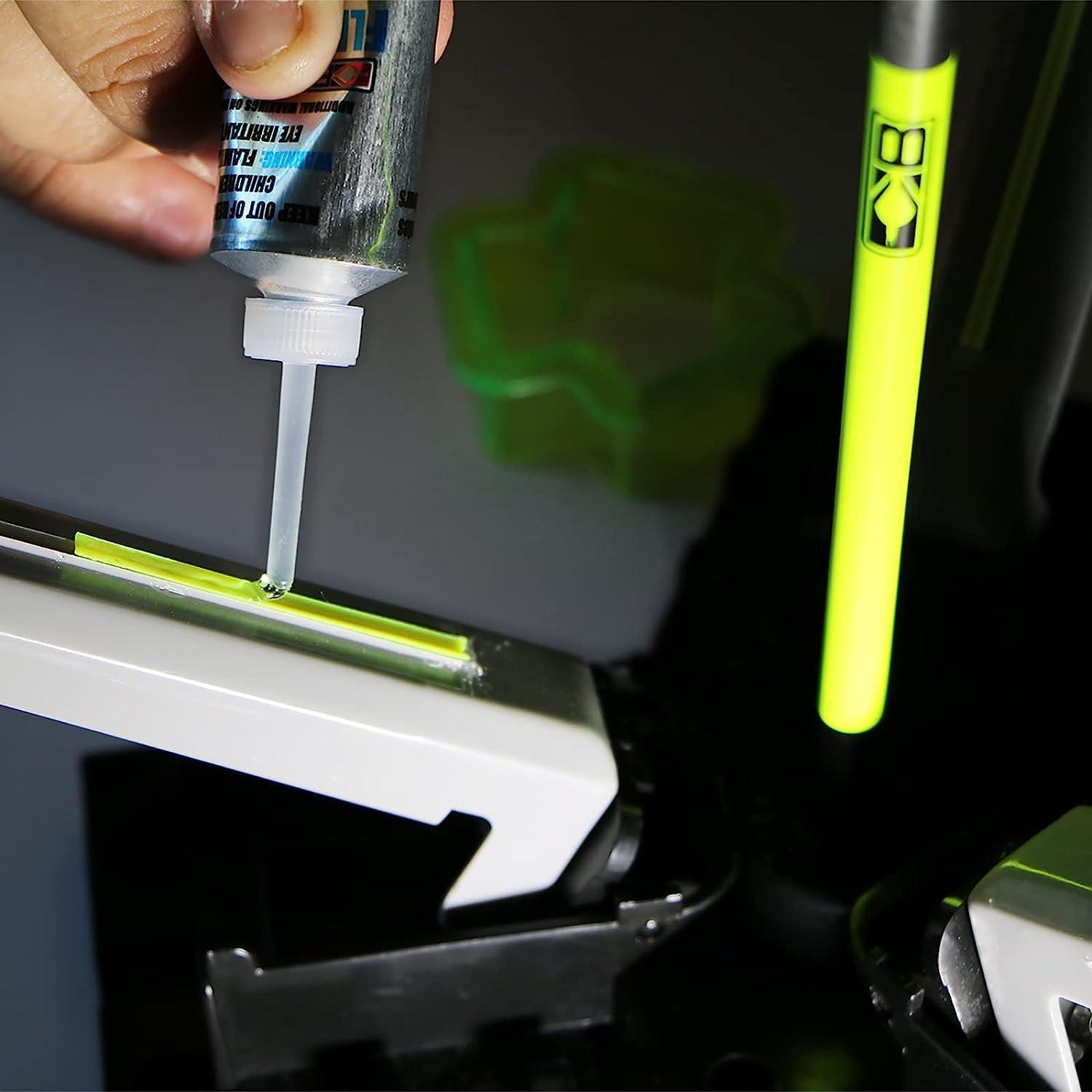 Applying Bohning Fletch-Tite Platinum glue to a neon yellow arrow fletching