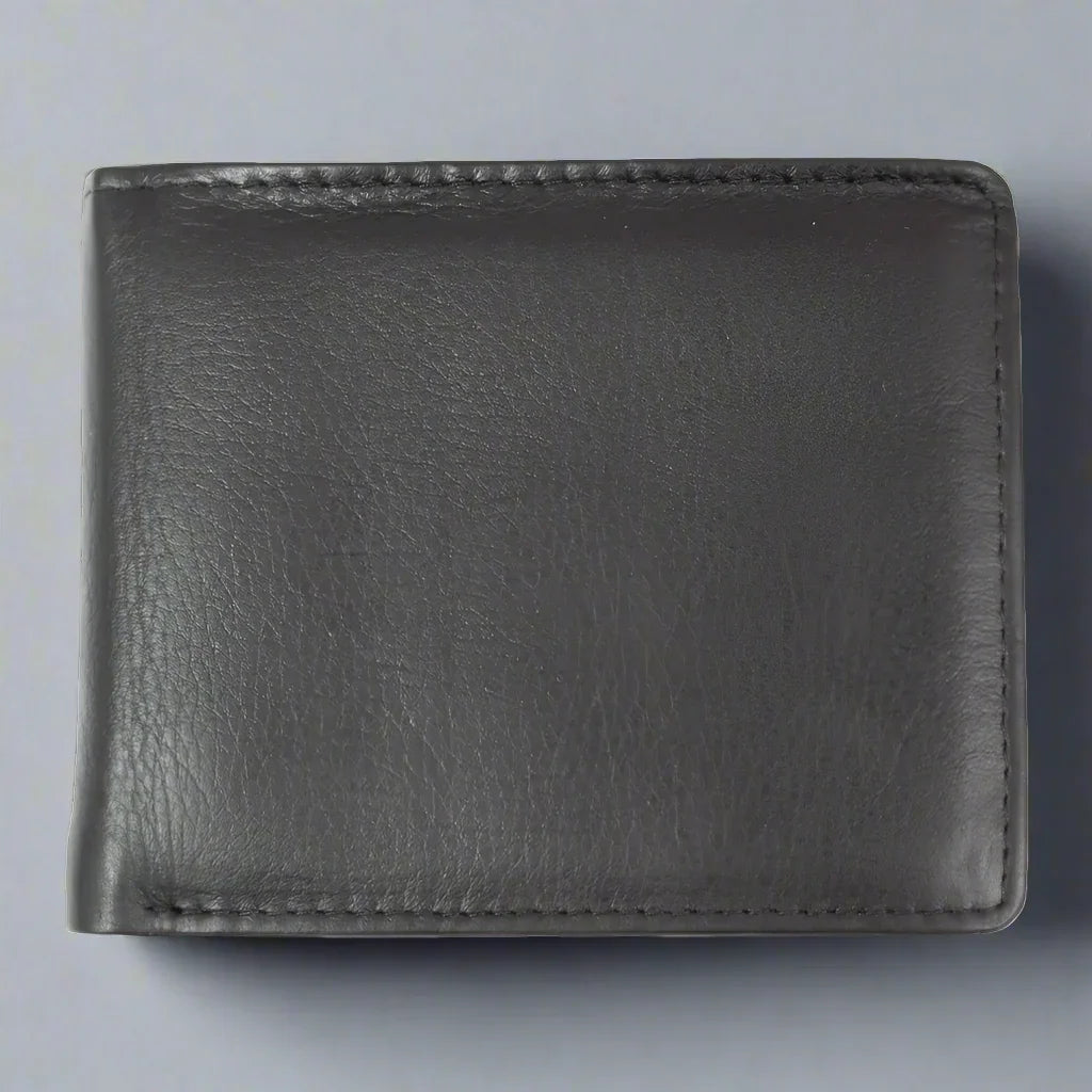 Men's black leather billfold wallet on a light gray background