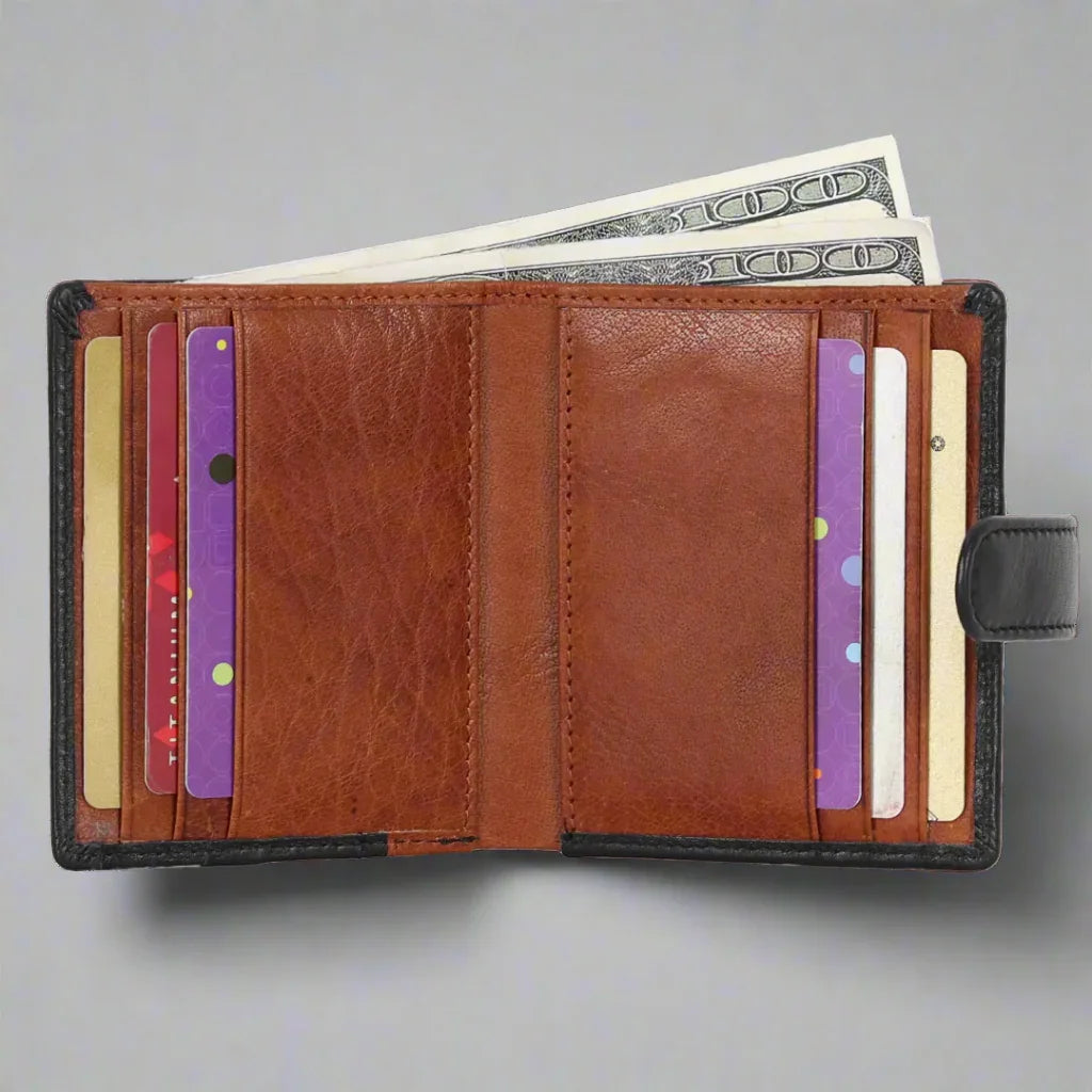 Open brown leather wallet with cards and cash on gray background