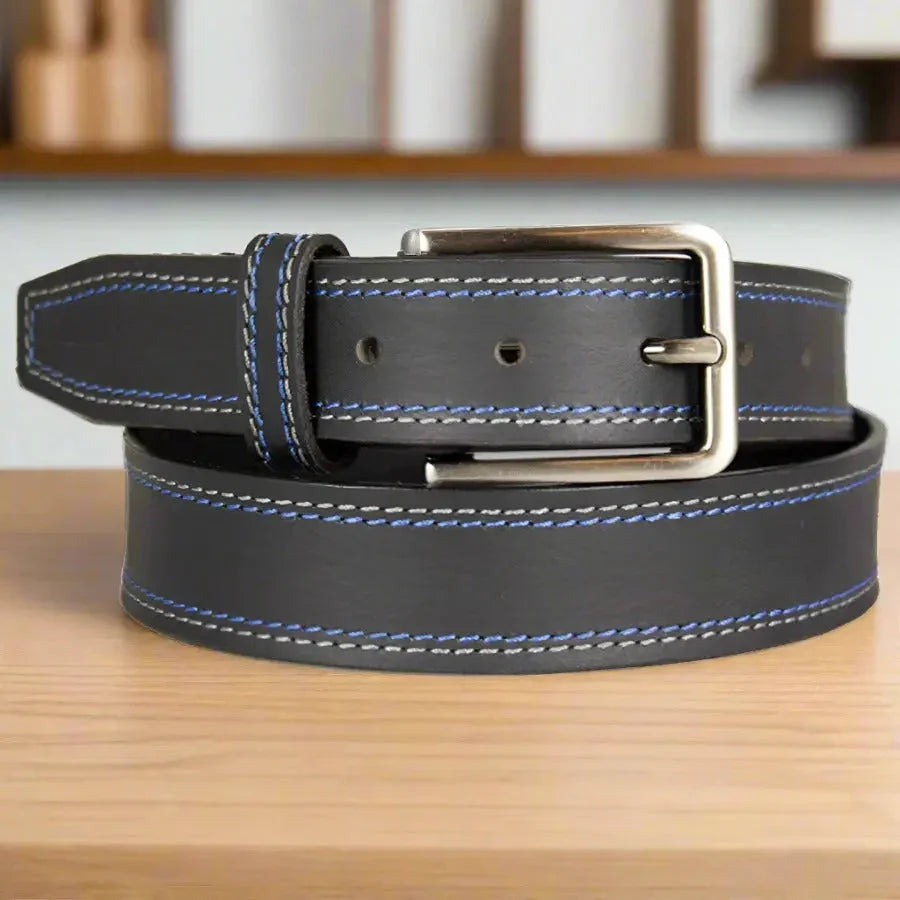 Men's black leather belt with blue contrast stitching and silver buckle on wood surface