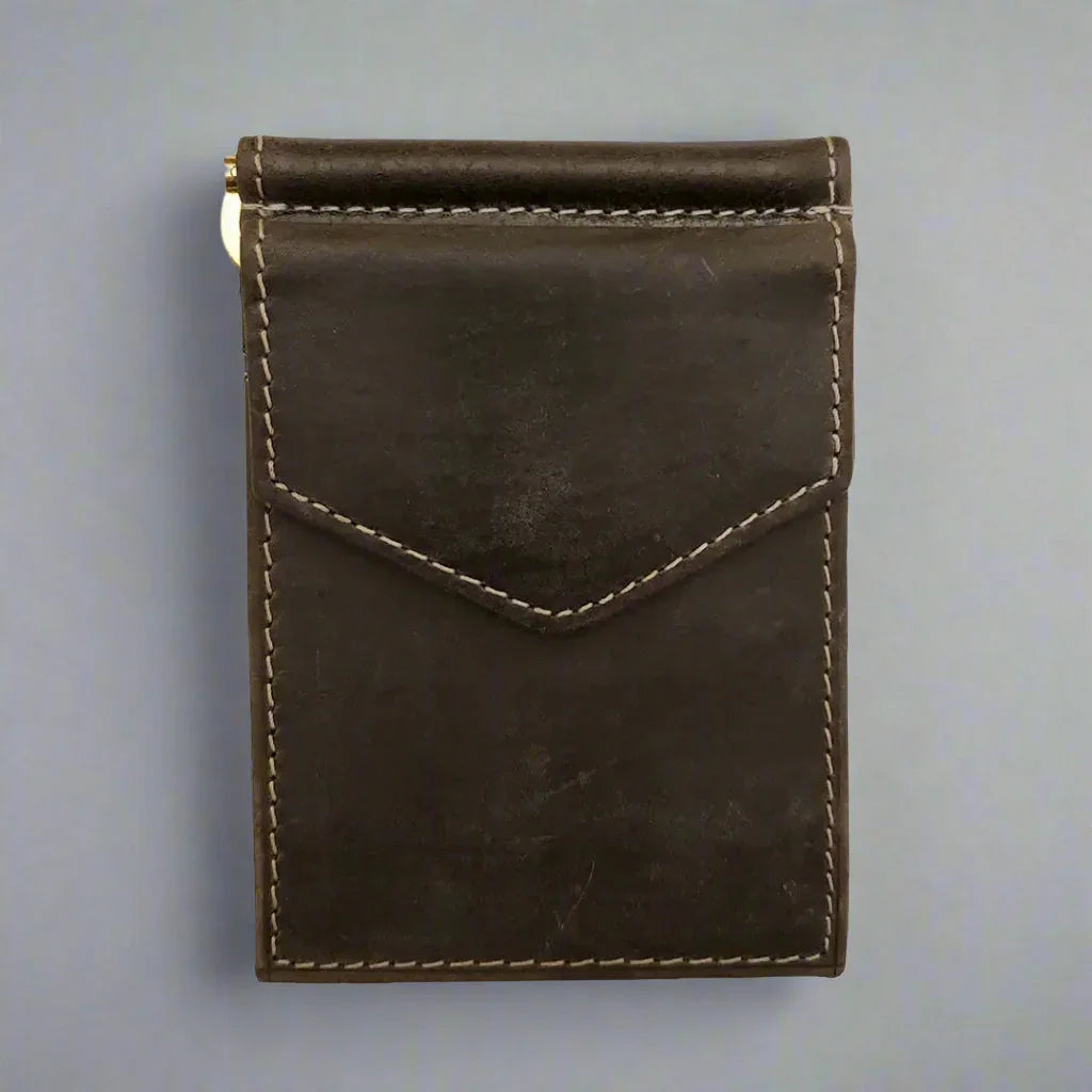 Men's distressed brown leather money clip wallet with visible white stitching on gray background