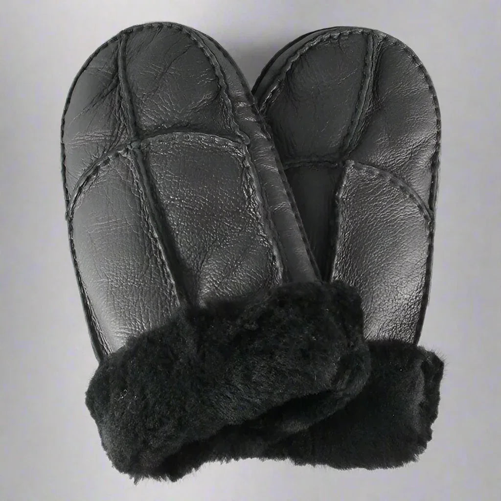 Black men's shearling leather mittens with fur cuffs on a gray background