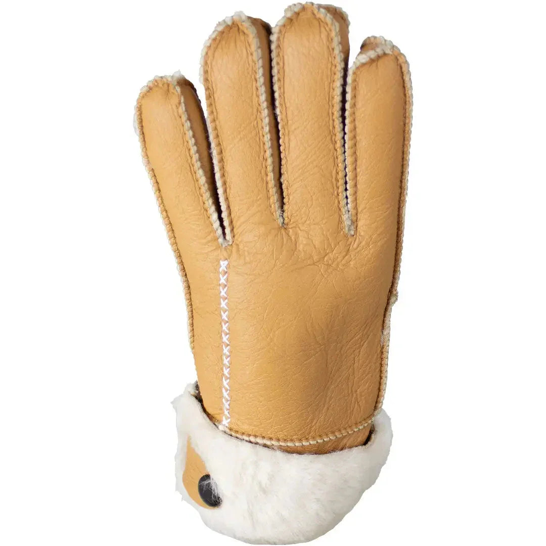 Tan hand-stitched women's merino sheepskin glove with white fur cuff on white background