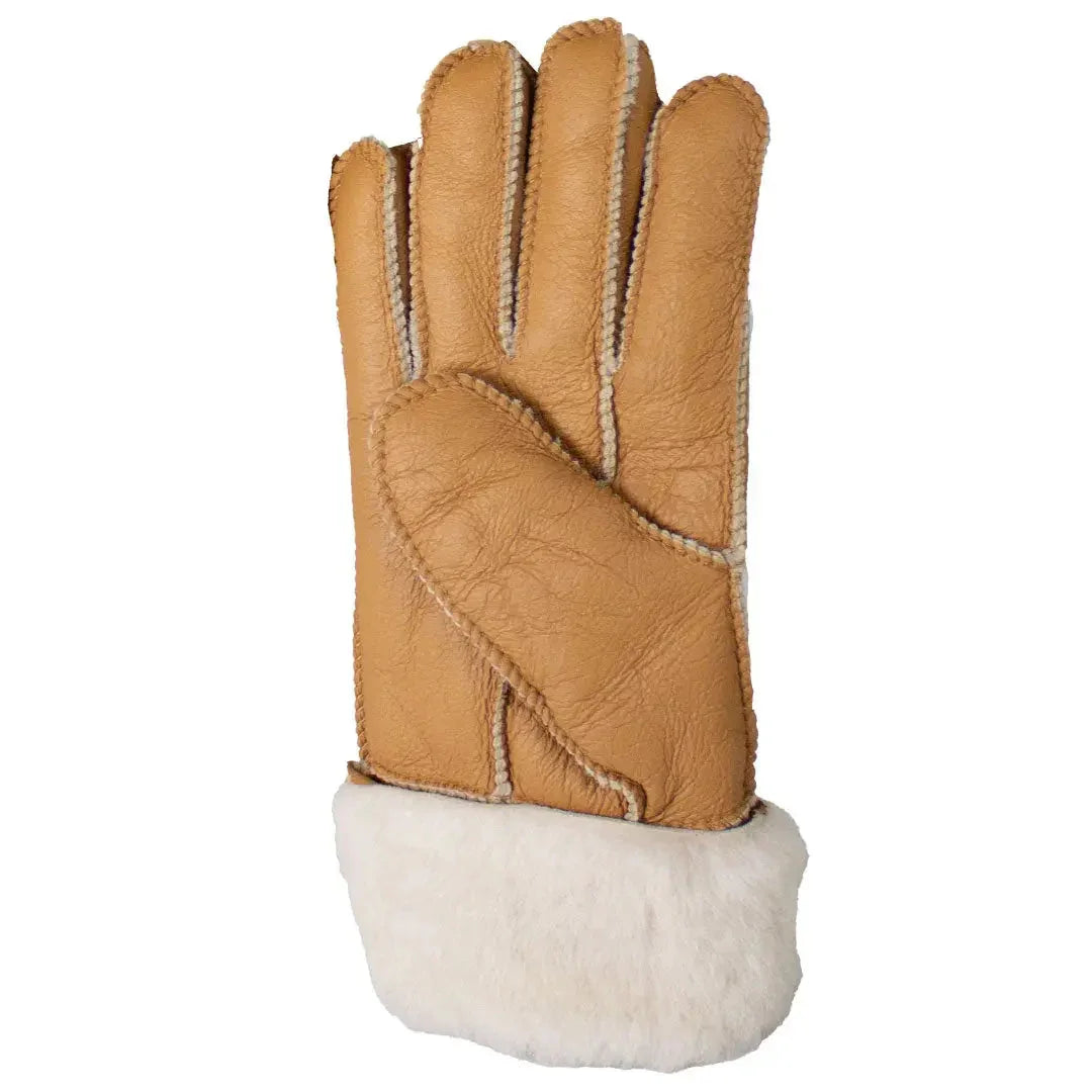 Tan merino sheepskin glove with hand-stitched seams and white fur cuff on white background