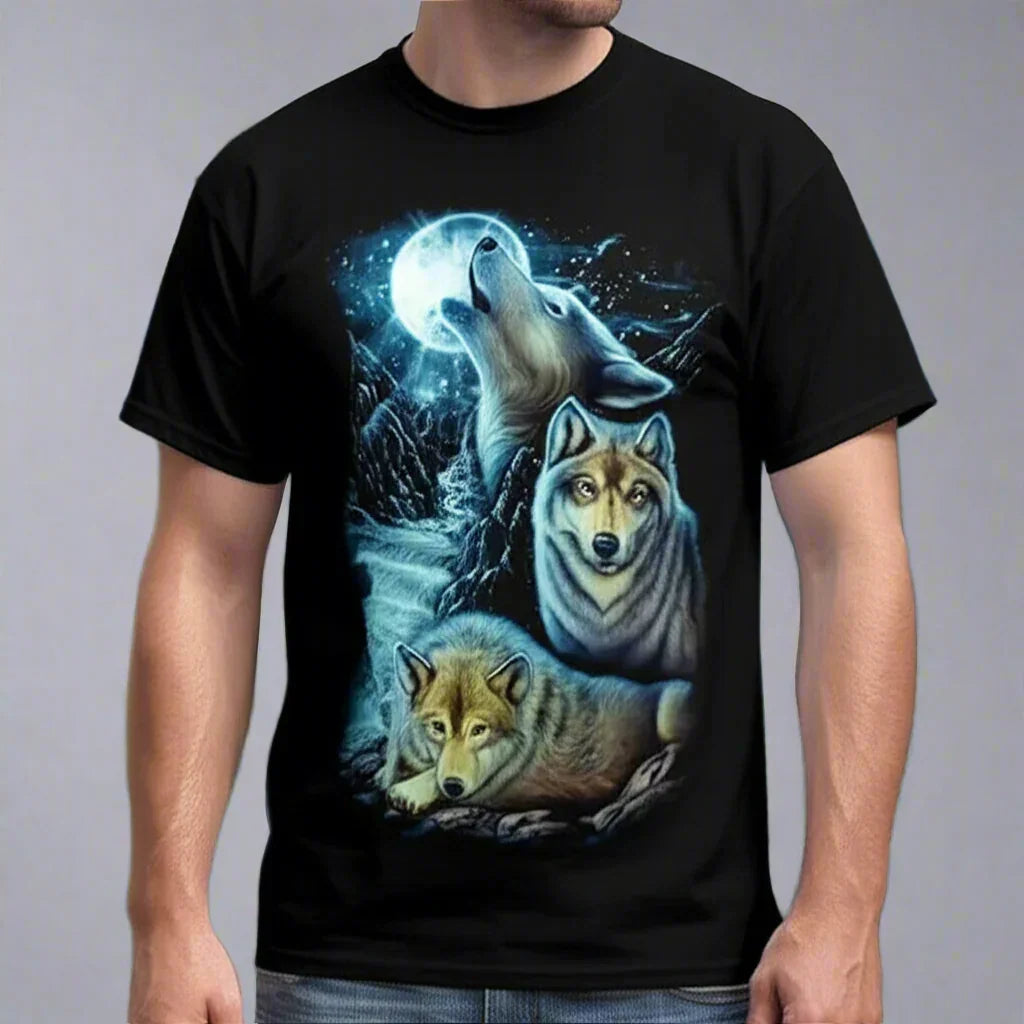 Black T-shirt with three wolves and full moon graphic, worn by a man against gray background