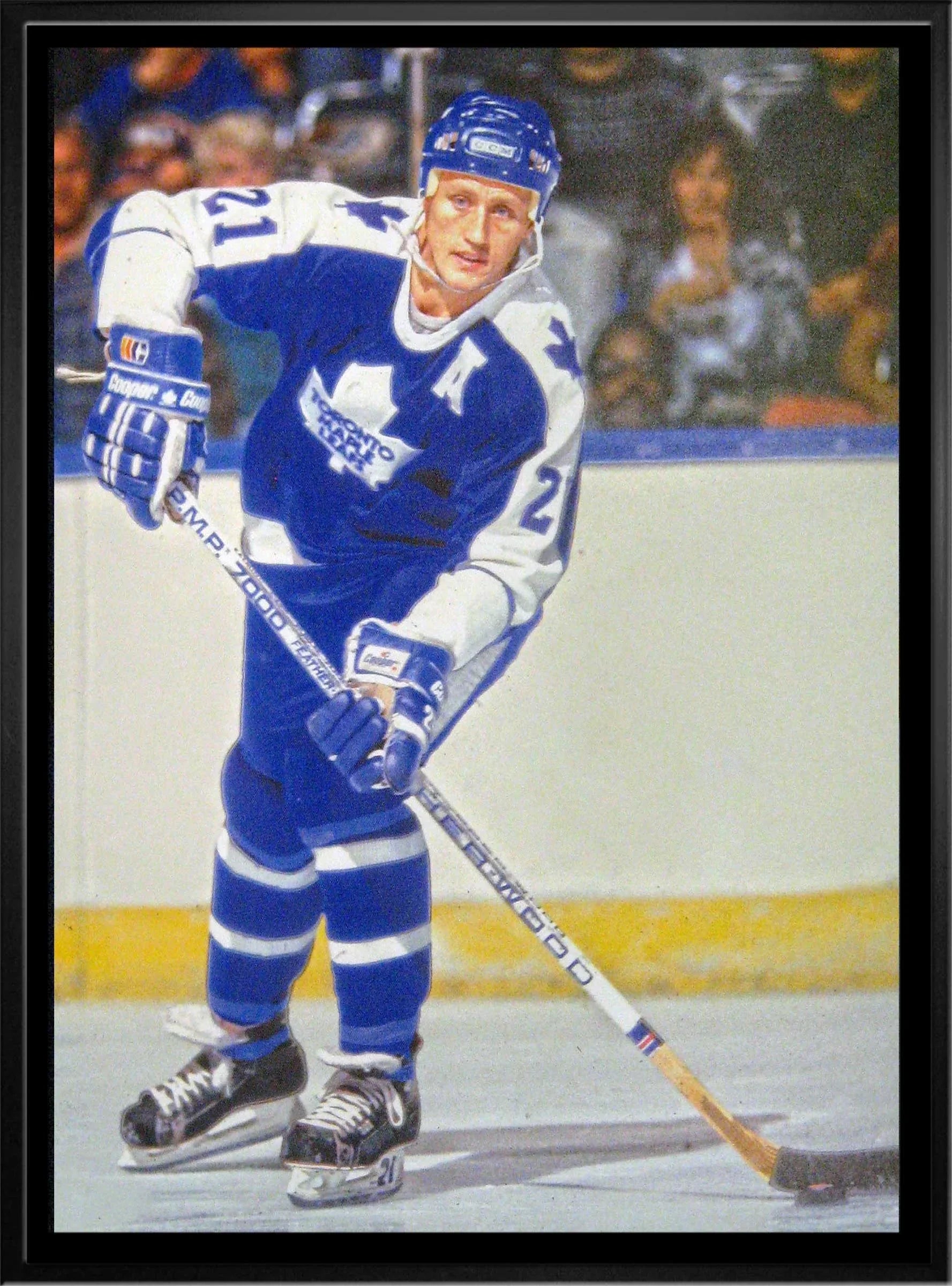 Toronto Maple Leafs hockey player in blue and white jersey skating on ice during game