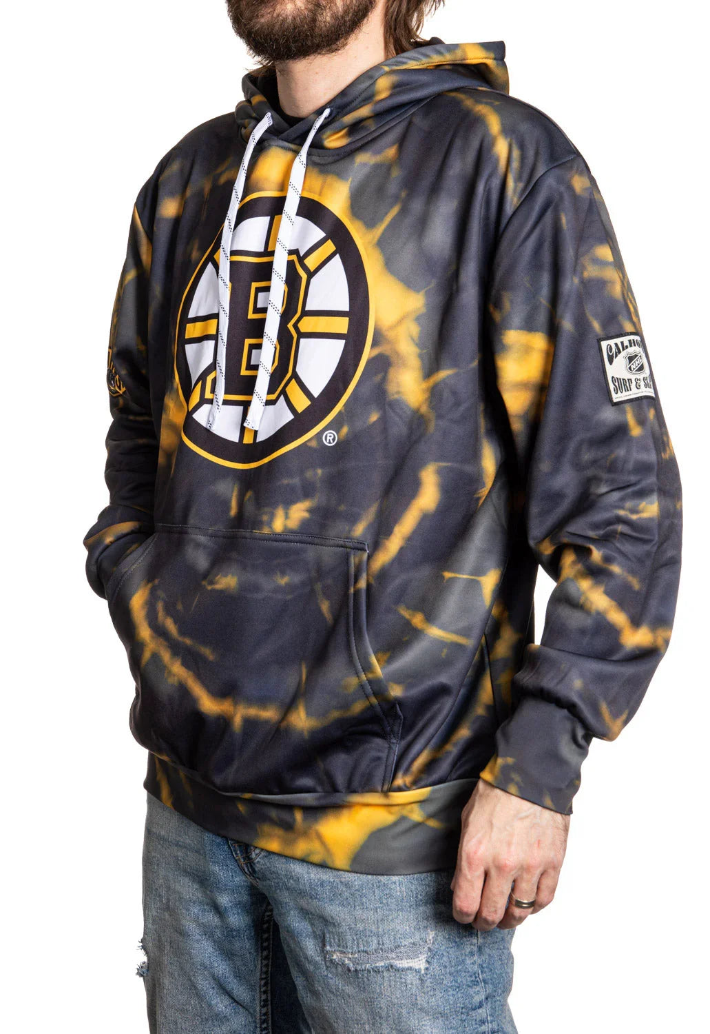 Boston Bruins tie-dye hoodie with black and yellow logo, worn by man in jeans