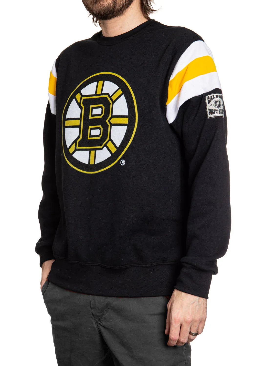 Man wearing black Boston Bruins NHL sweatshirt with yellow and white stripes on sleeves