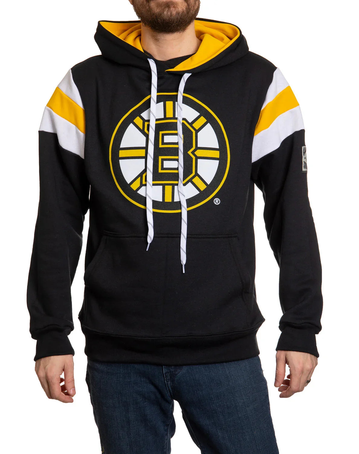 Man wearing black Boston Bruins hoodie with yellow and white stripes on sleeves