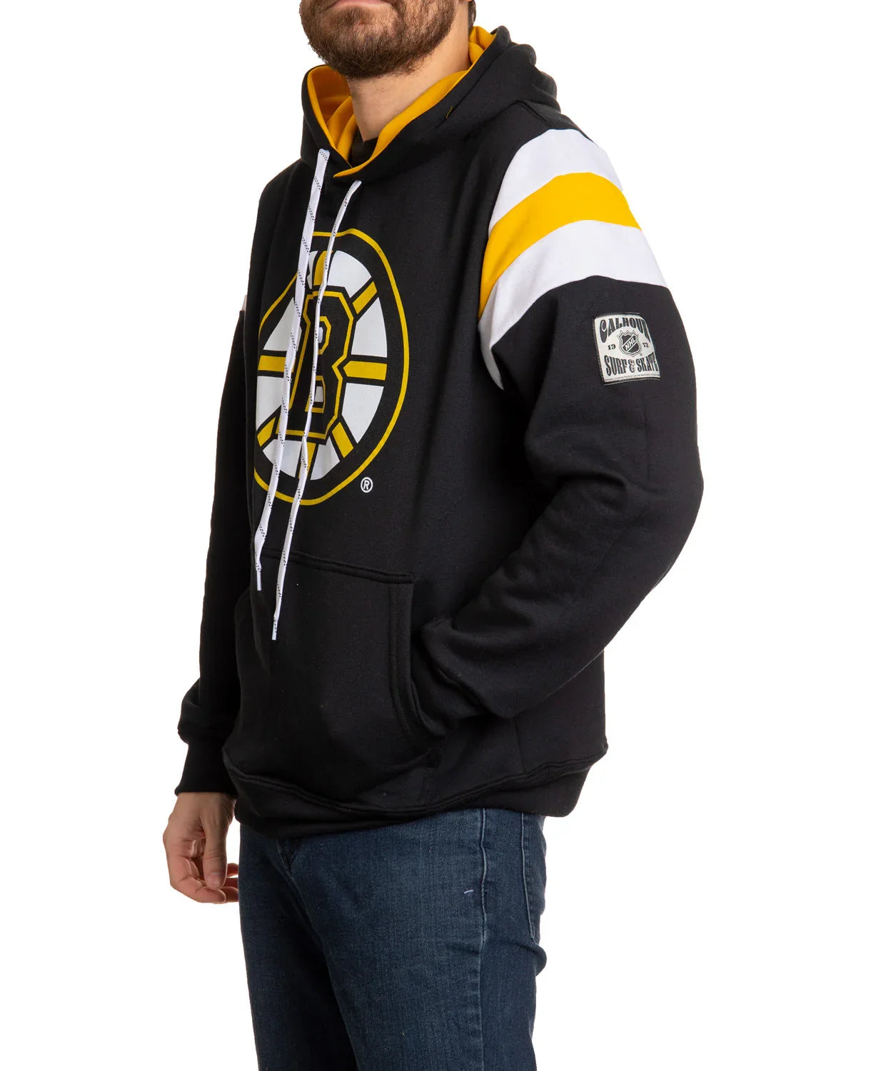 Man wearing black Boston Bruins hoodie with logo and yellow white stripes on sleeve