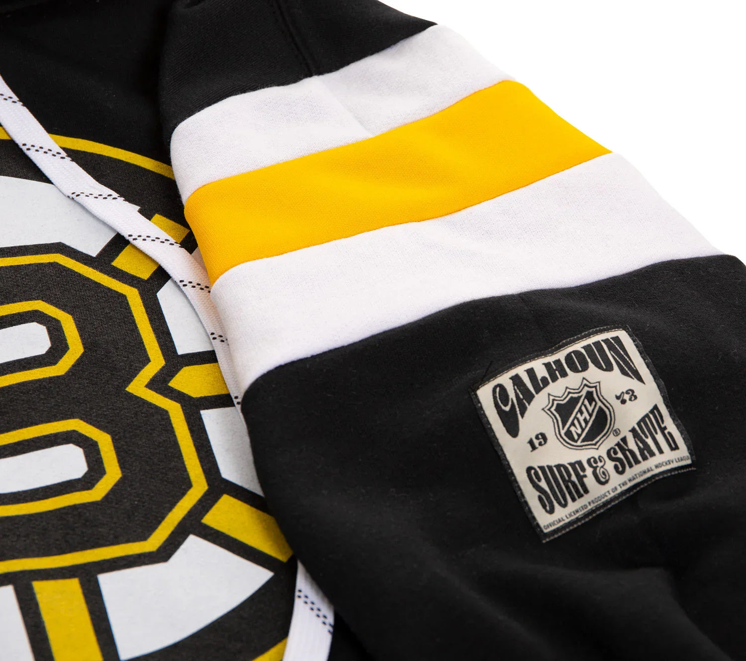 Black hoodie with yellow and white stripes, Boston hockey logo, Calhoun NHL Surf & Skate patch