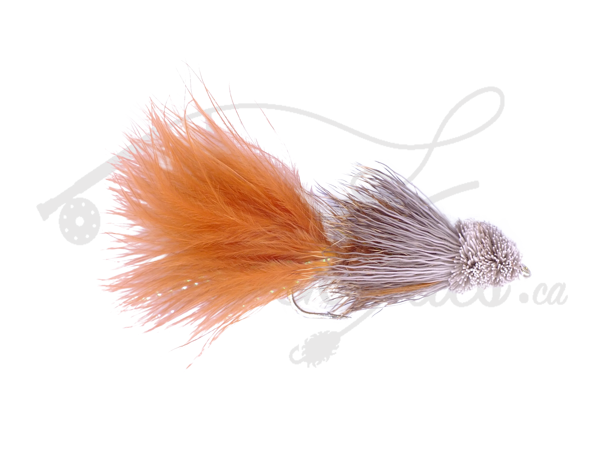Brown Bow River Bugger fly fishing lure with bushy tail and sculpted head on white background