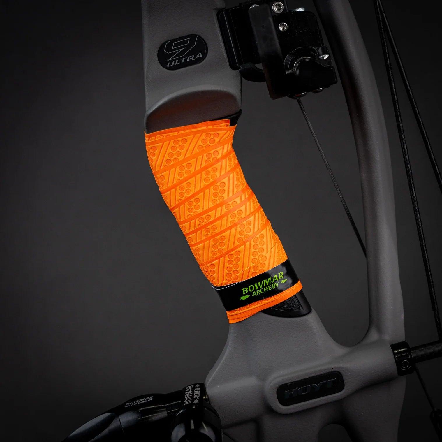 Close-up of orange Bowmar Archery grip wrap on a Hoyt compound bow