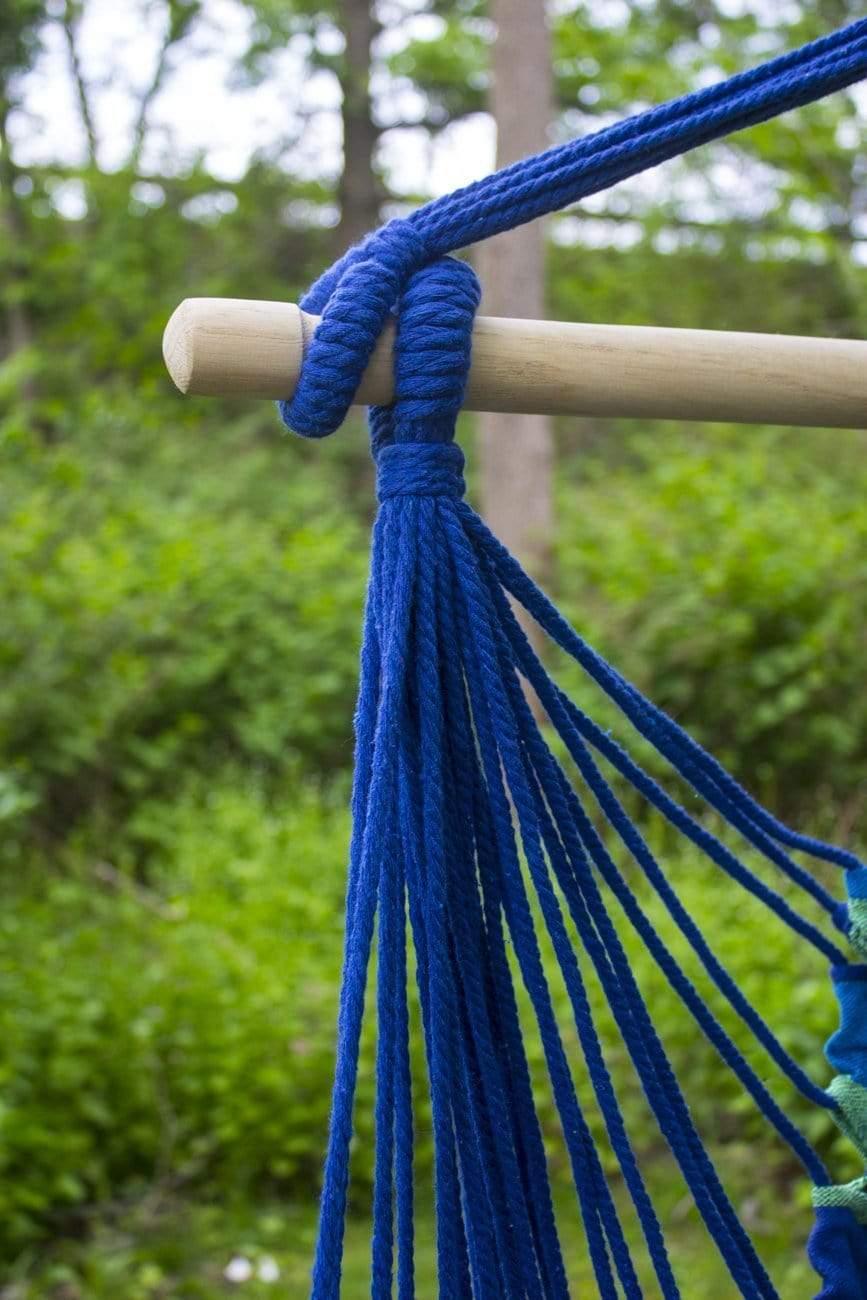 Close-up of blue rope on a wooden bar for a Brazilian hammock chair outdoors