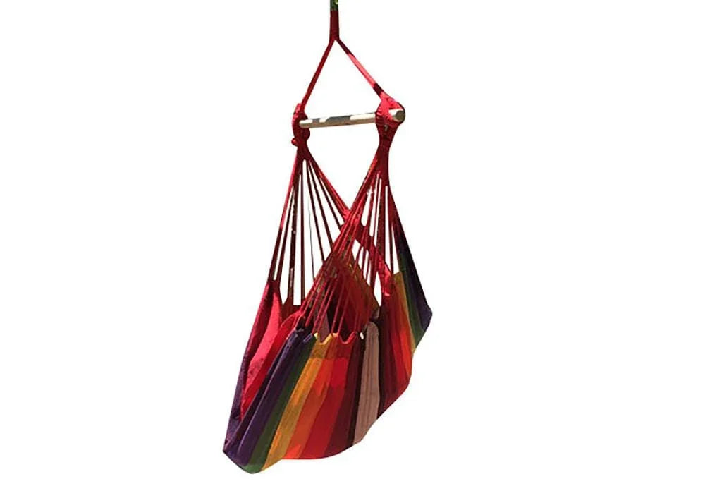 Brazilian hammock chair in vibrant striped colors hanging on a wooden bar