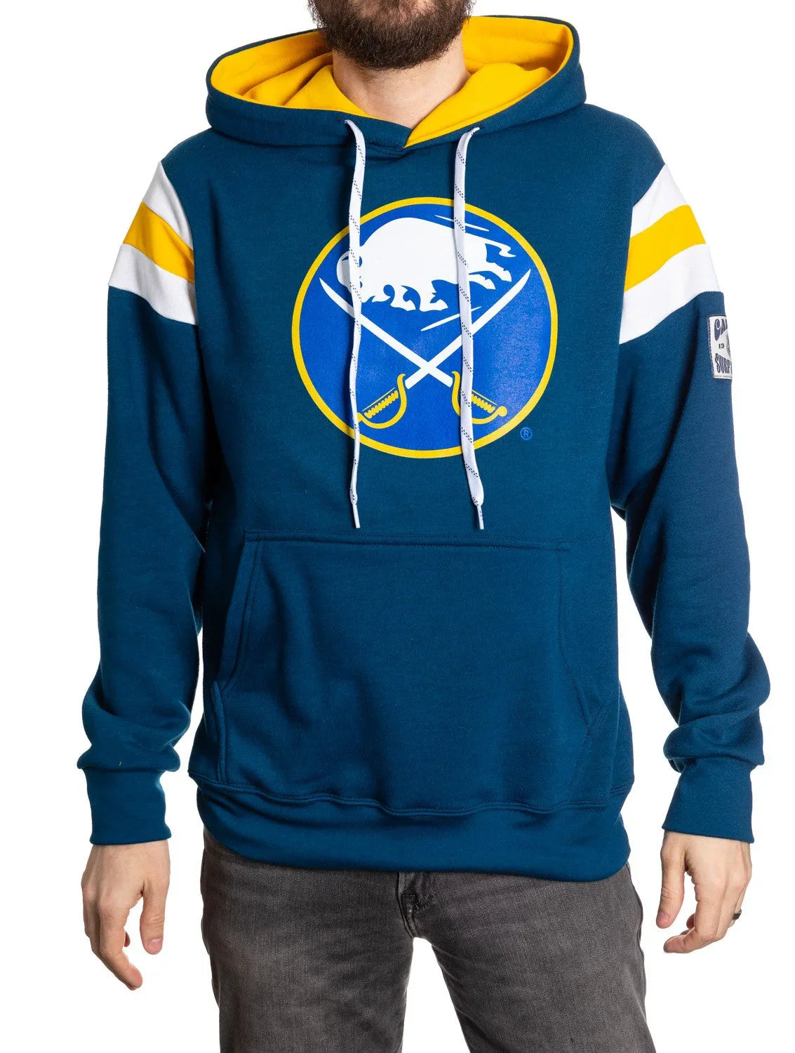 Man wearing blue Buffalo Sabres varsity hoodie with logo and yellow accent stripes