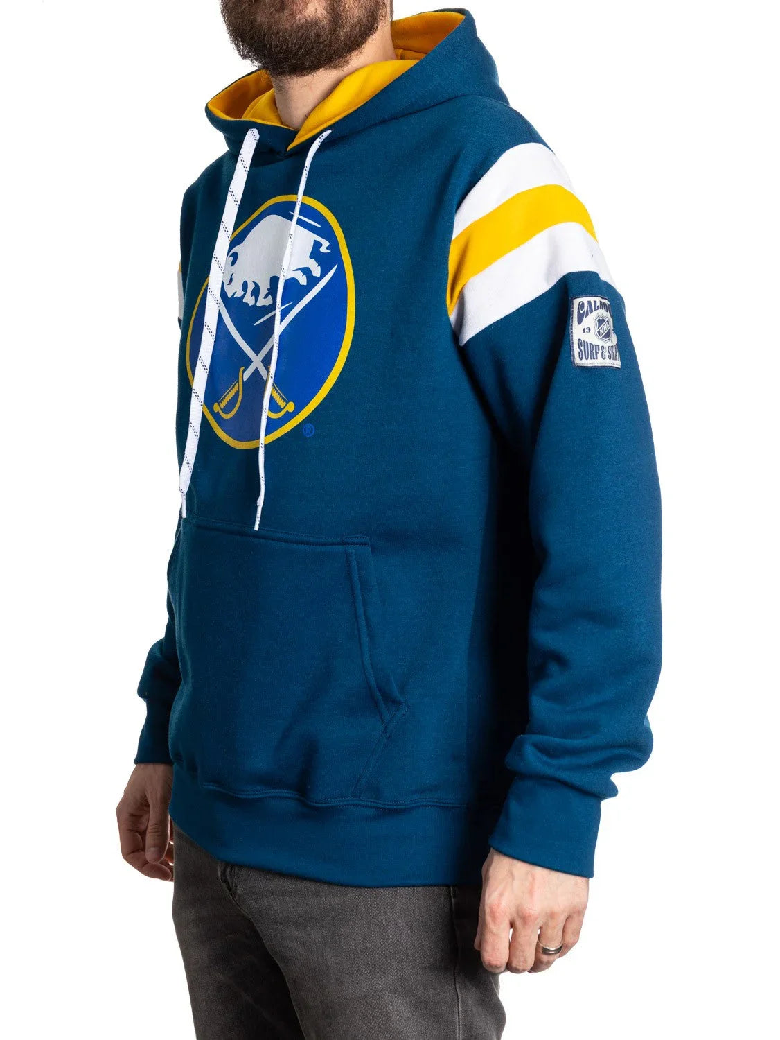 Man wearing blue Buffalo Sabres hoodie with yellow and white stripes, logo on chest