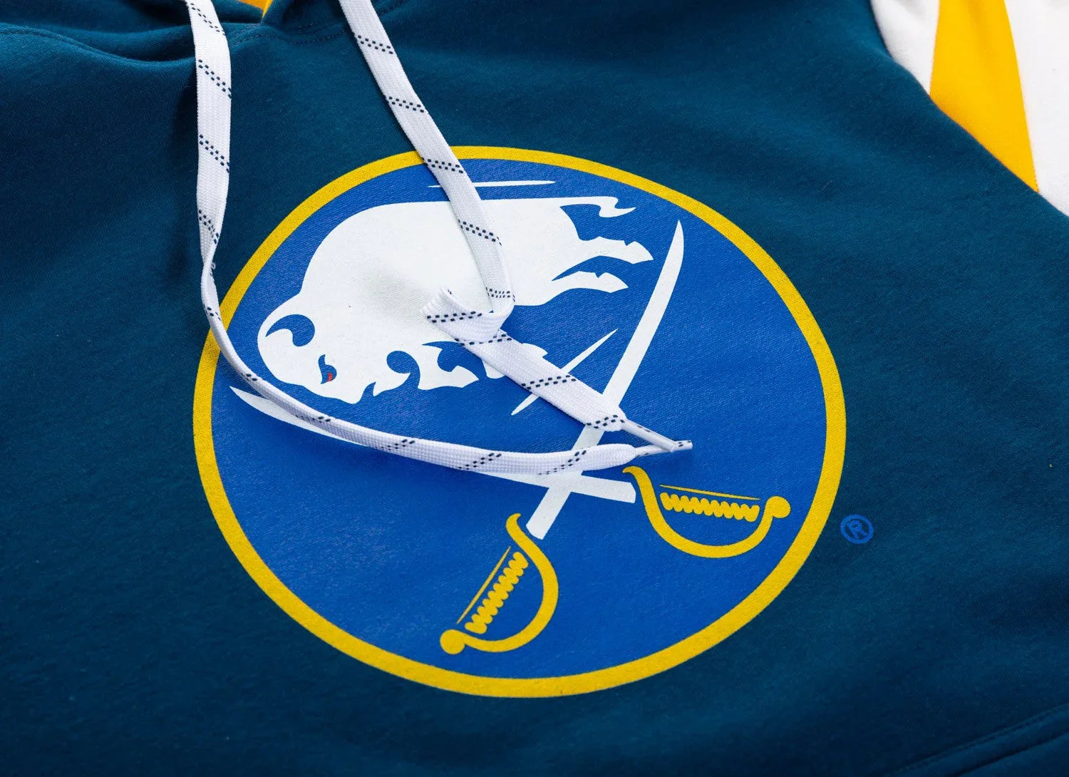 Buffalo Sabres logo detail on blue hoodie with white drawstrings