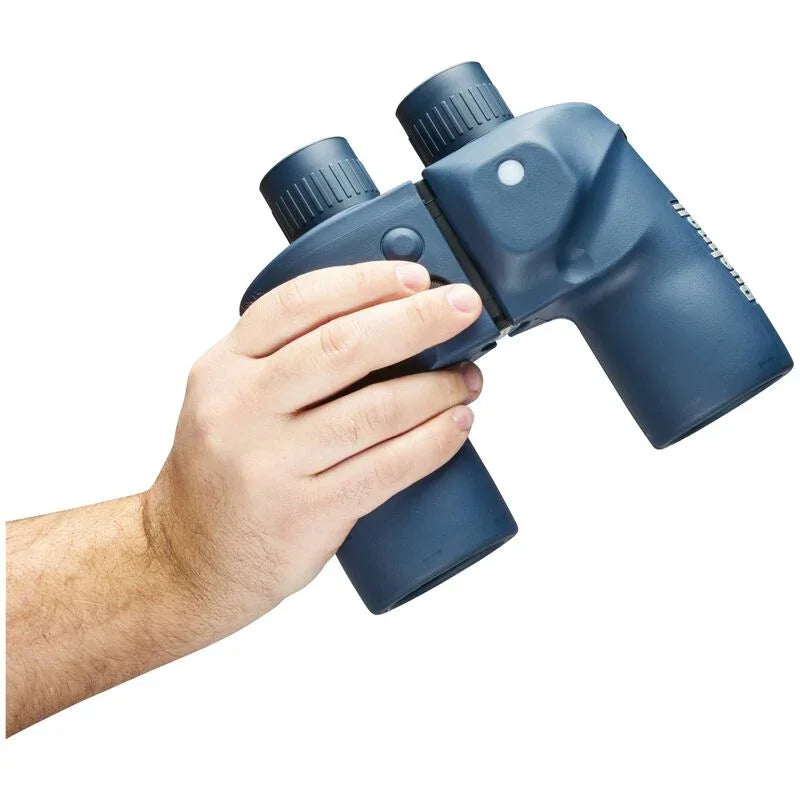 Hand holding blue marine binoculars against white background