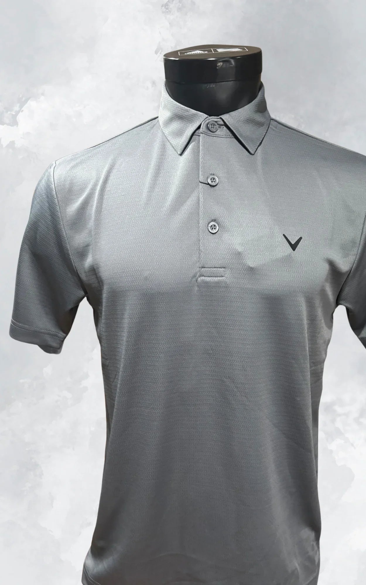 Gray short sleeve men's polo shirt with buttons and logo on chest, displayed on mannequin