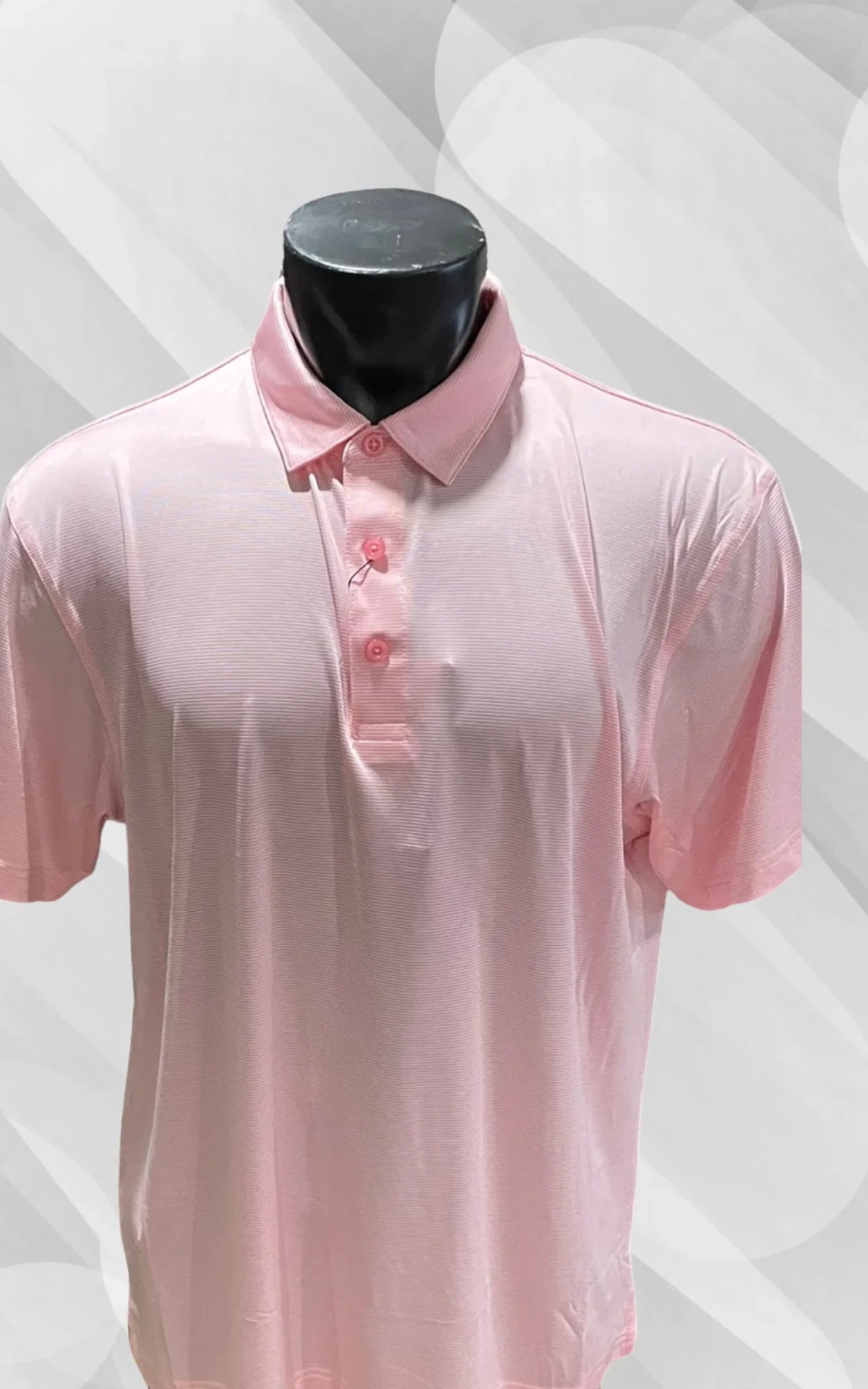 Light pink short sleeve polo shirt on mannequin with subtle stripe pattern