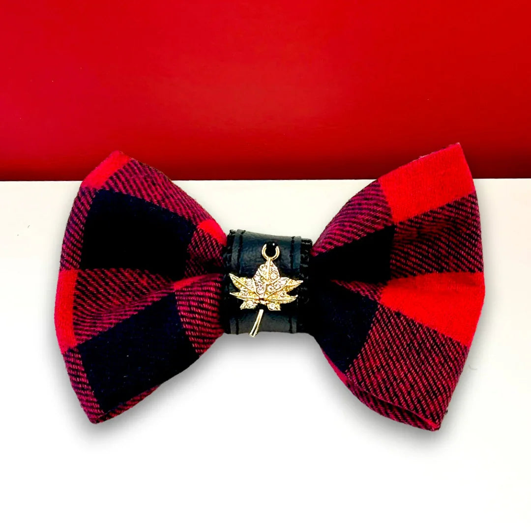 Red and black plaid bow tie with leather center and gold maple leaf charm