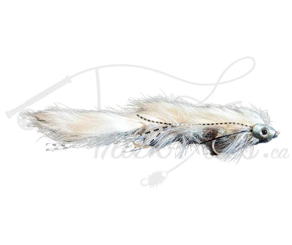 White streamer fly fishing lure with silver head and realistic eye detail on white background