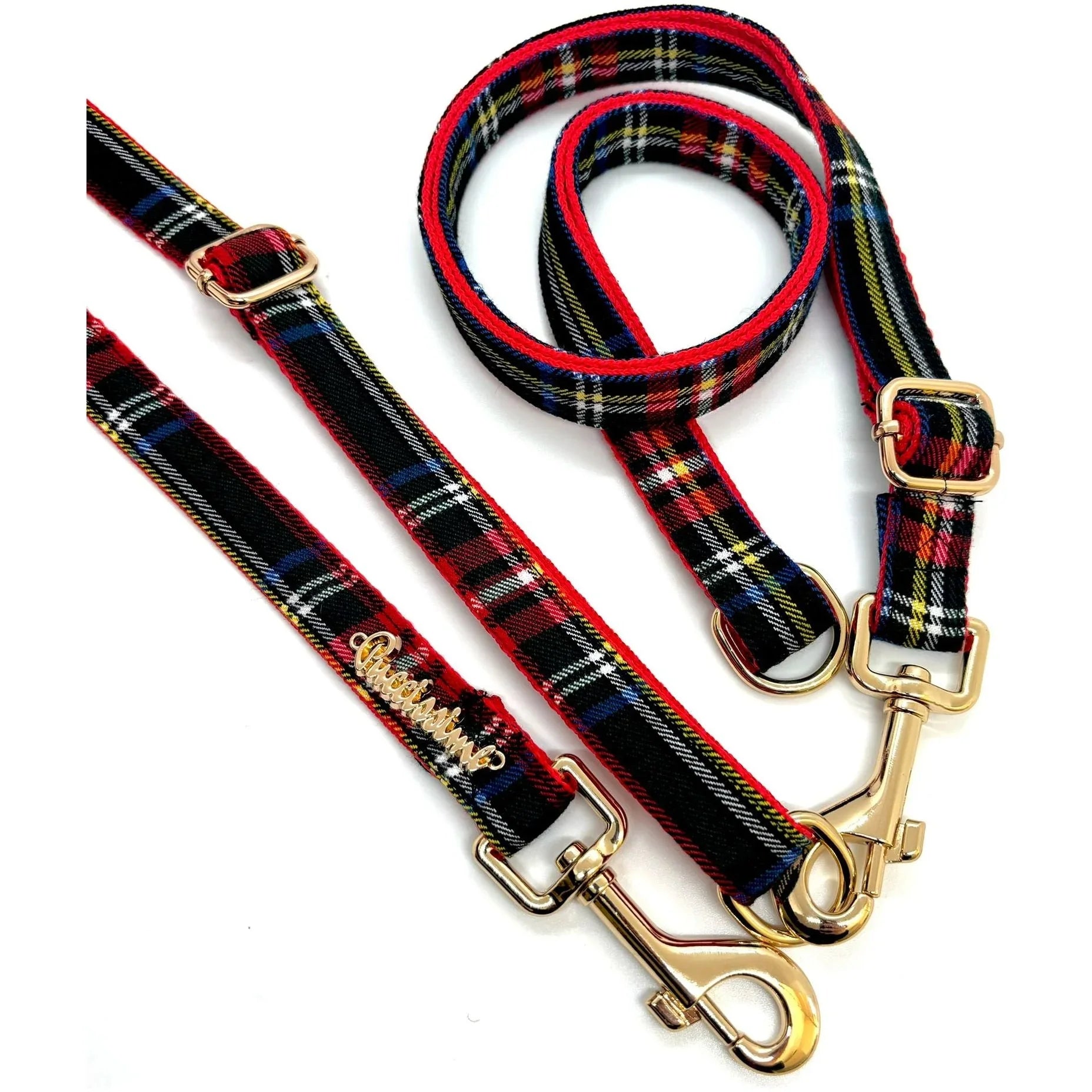 Plaid dog leash and collar set with gold hardware on white background.