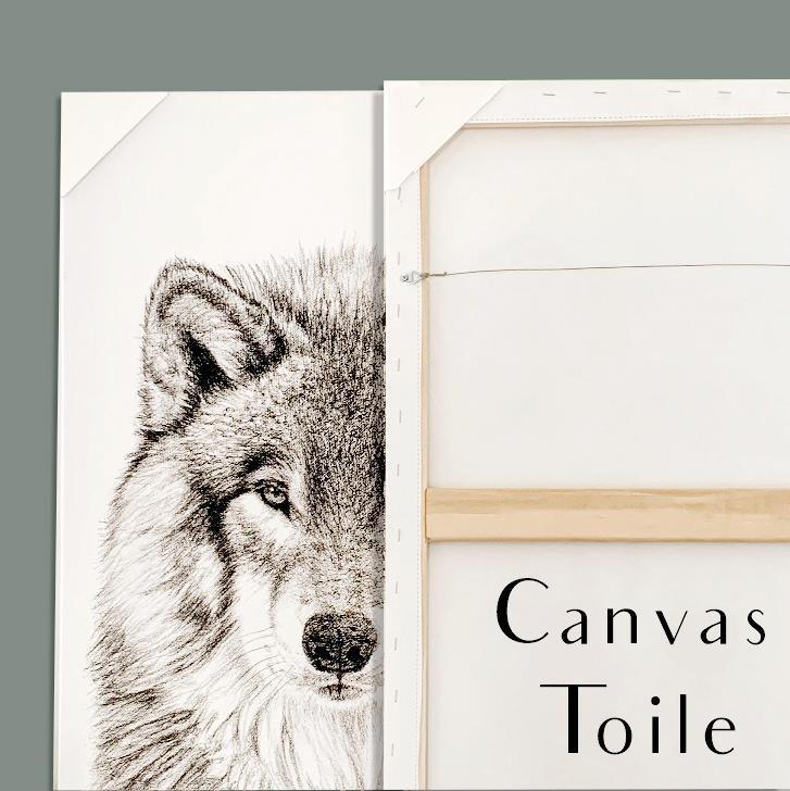Close-up of a framed wolf canvas art print, front and back on light grey background.