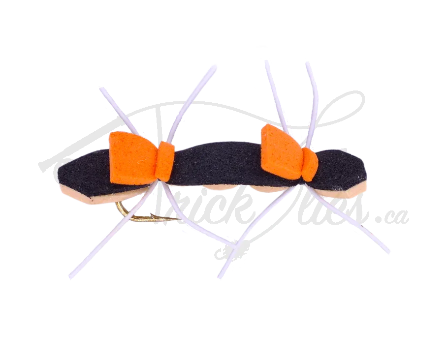 Chernobyl ant fishing fly with black foam body, orange segments, and white legs