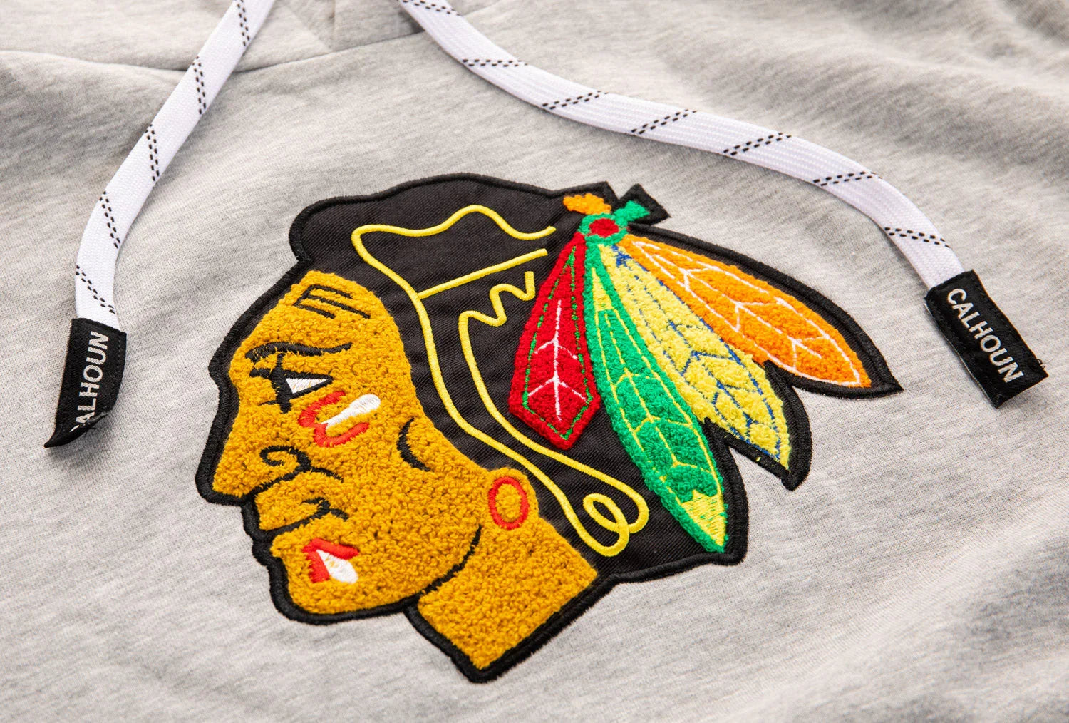 Chicago hockey team logo patch on grey Calhoun hoodie with drawstrings