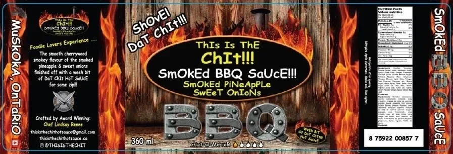 Smoked BBQ sauce label featuring fiery background, metallic BBQ text, smoked pineapple and sweet onion flavors.