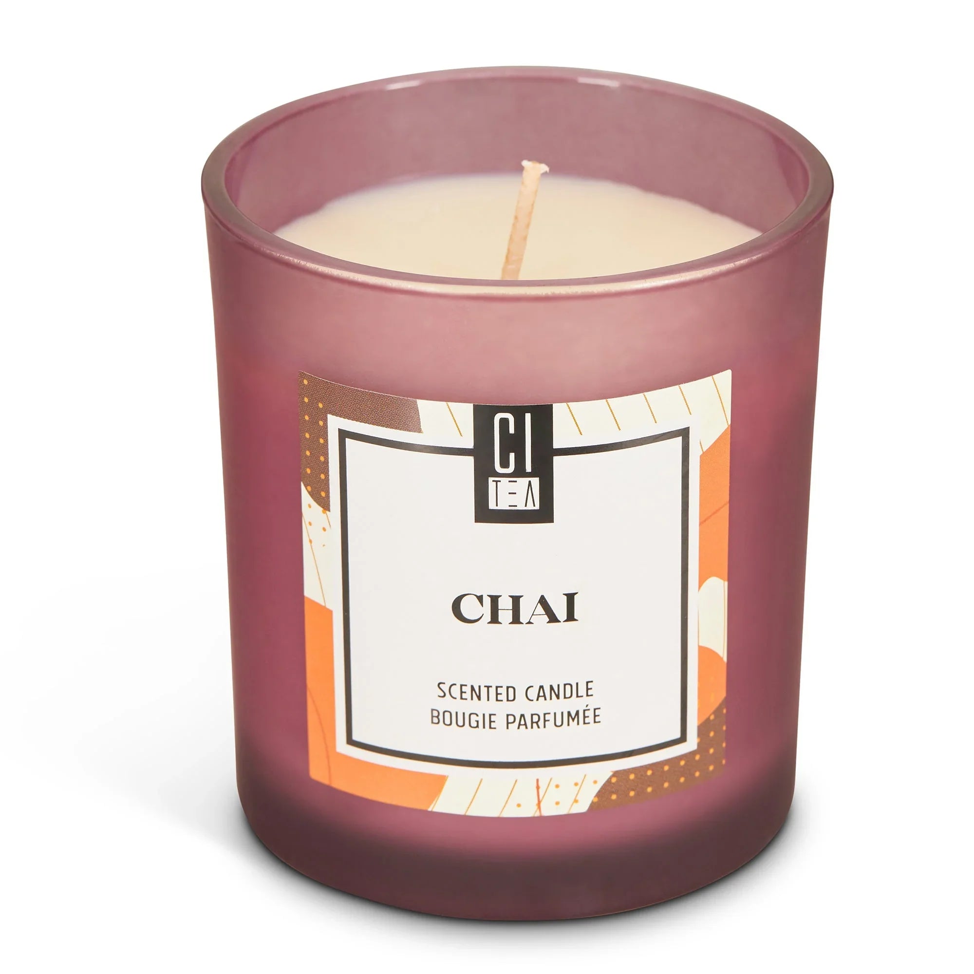 Chai spice soy wax candle in purple glass jar with decorative label