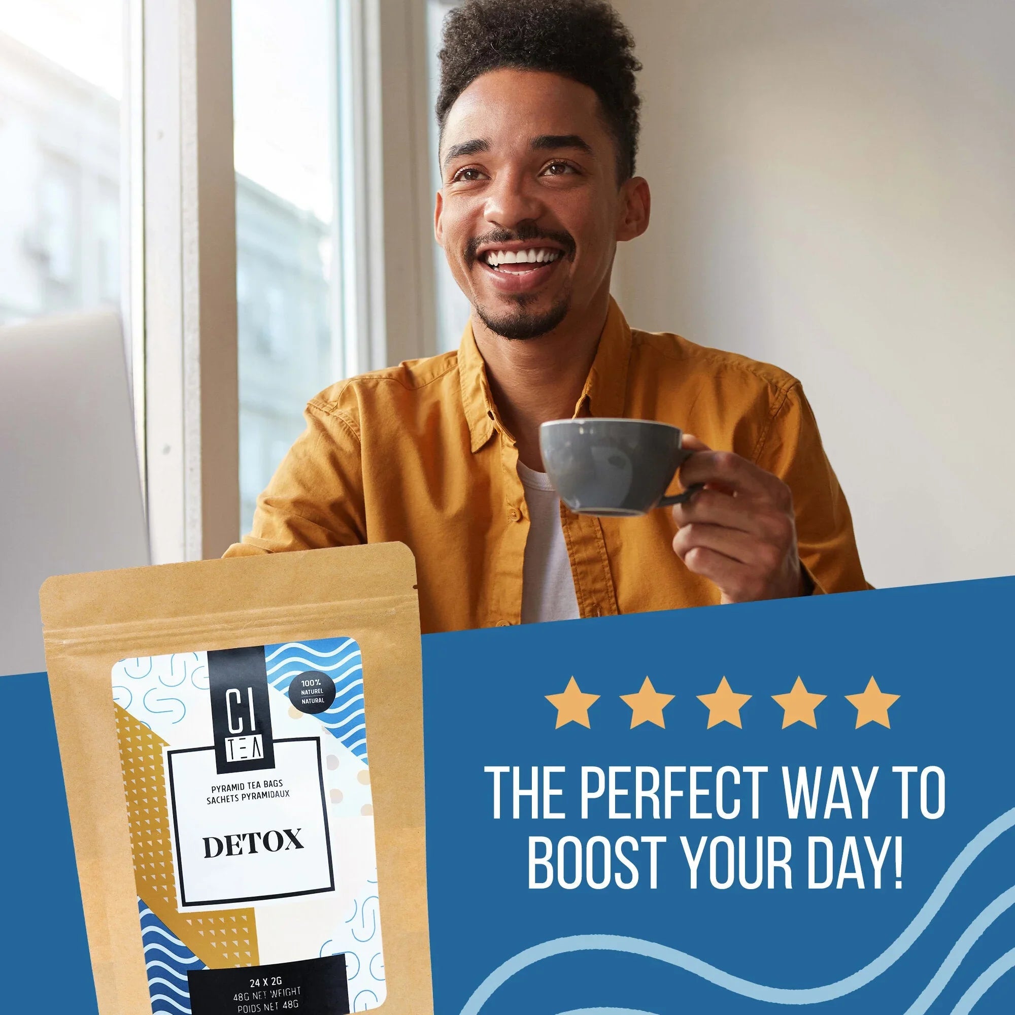 Smiling man holding cup with Citea Detox tea packaging and 'The perfect way to boost your day' text