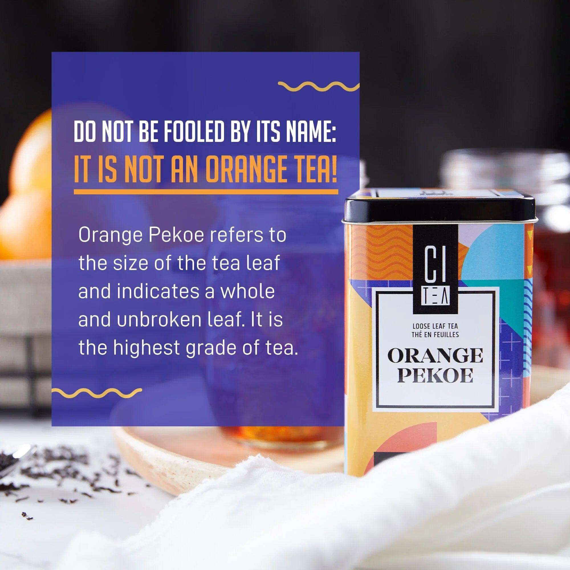 Citea Orange Pekoe loose leaf tea tin with informative text about tea grade on a kitchen counter.