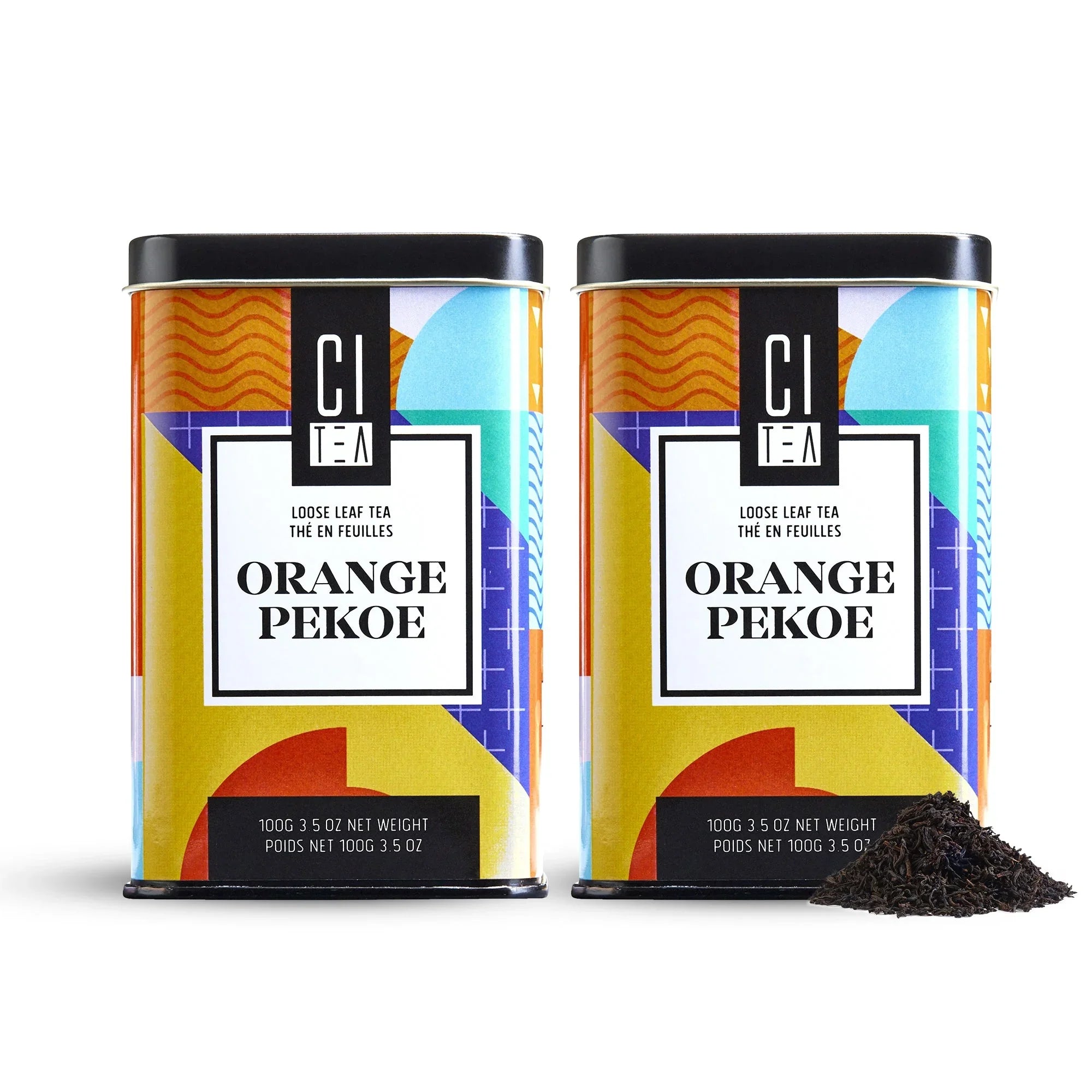 Two CI Tea Orange Pekoe loose leaf tea tins with colorful geometric labels and loose tea pile