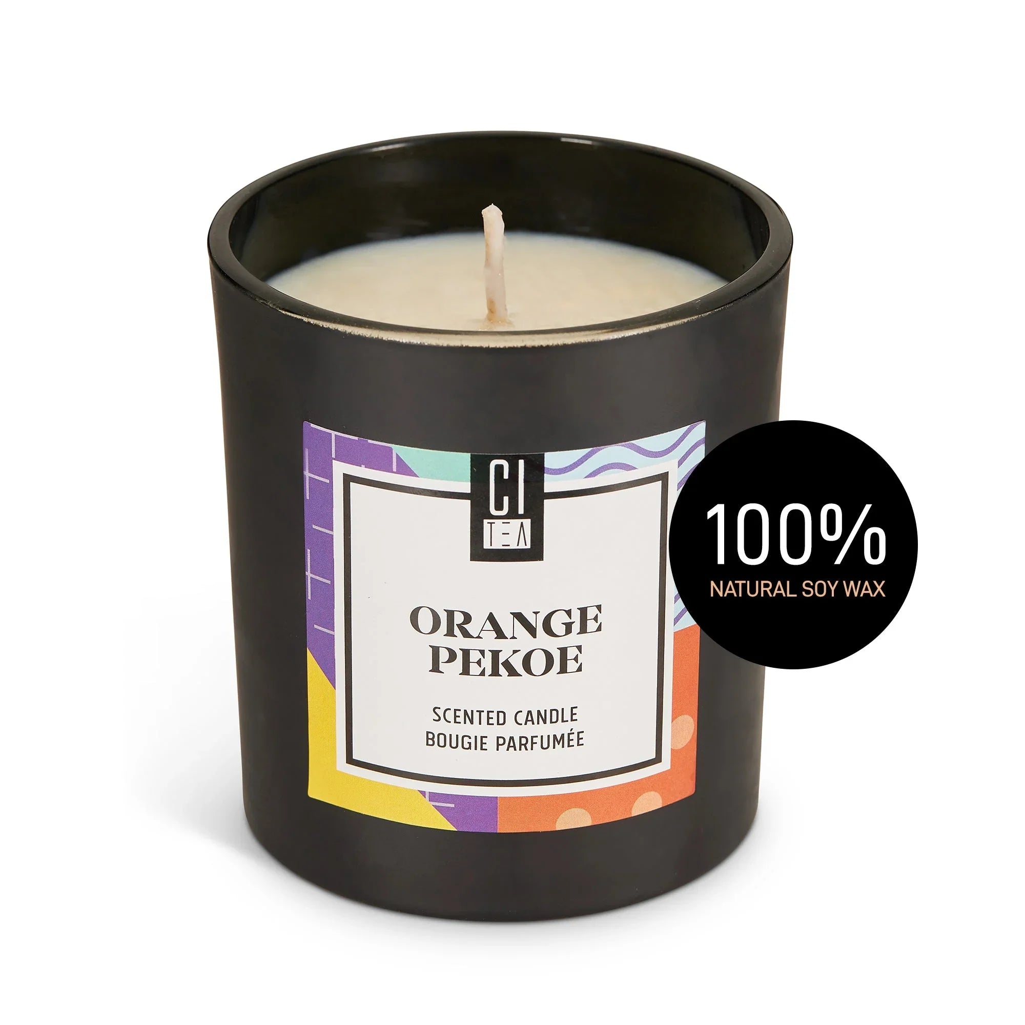 Orange Pekoe soy wax scented candle in a black jar with colorful label and 100% natural soy wax badge
