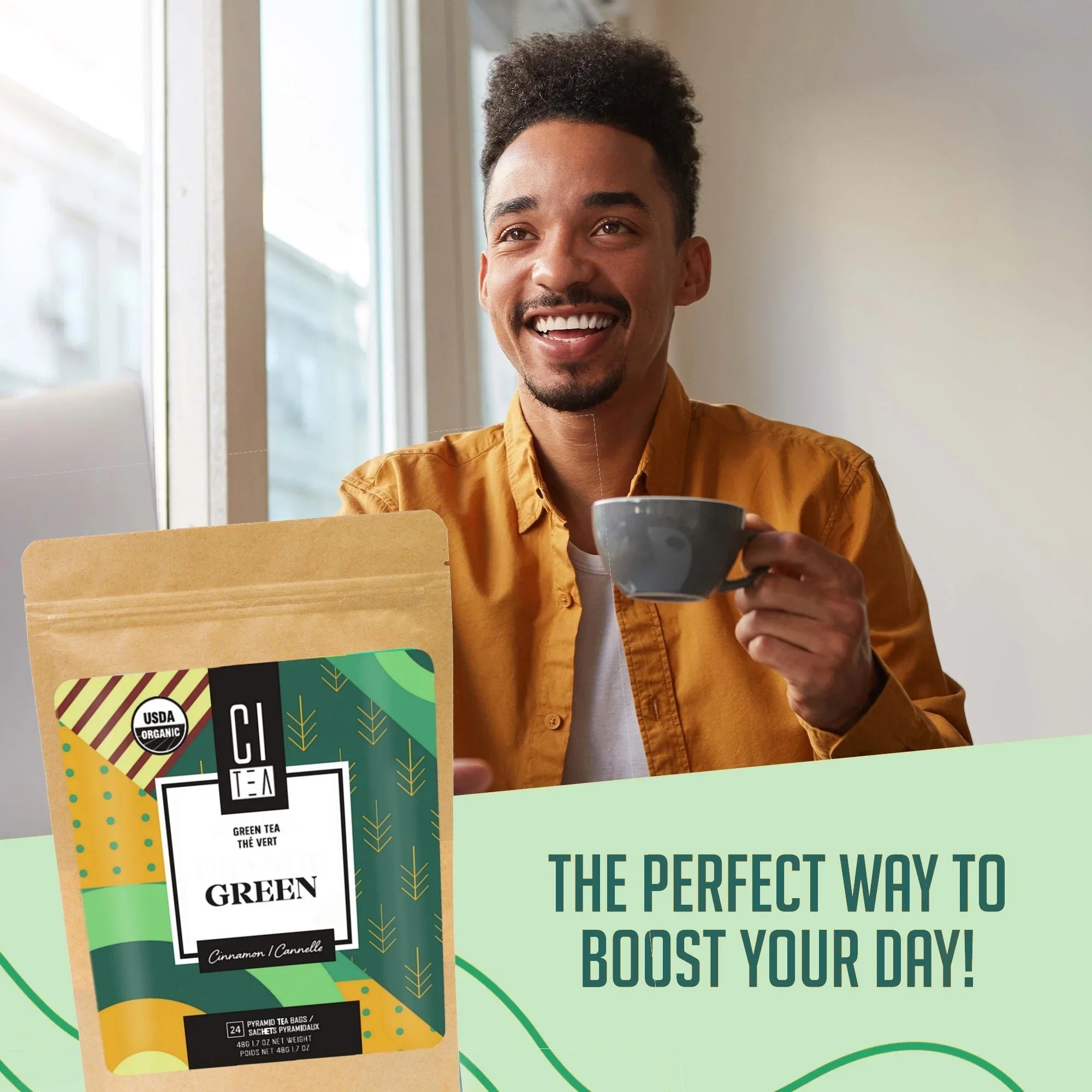 Smiling man enjoying green tea, CI Tea organic cinnamon flavor, morning boost at home