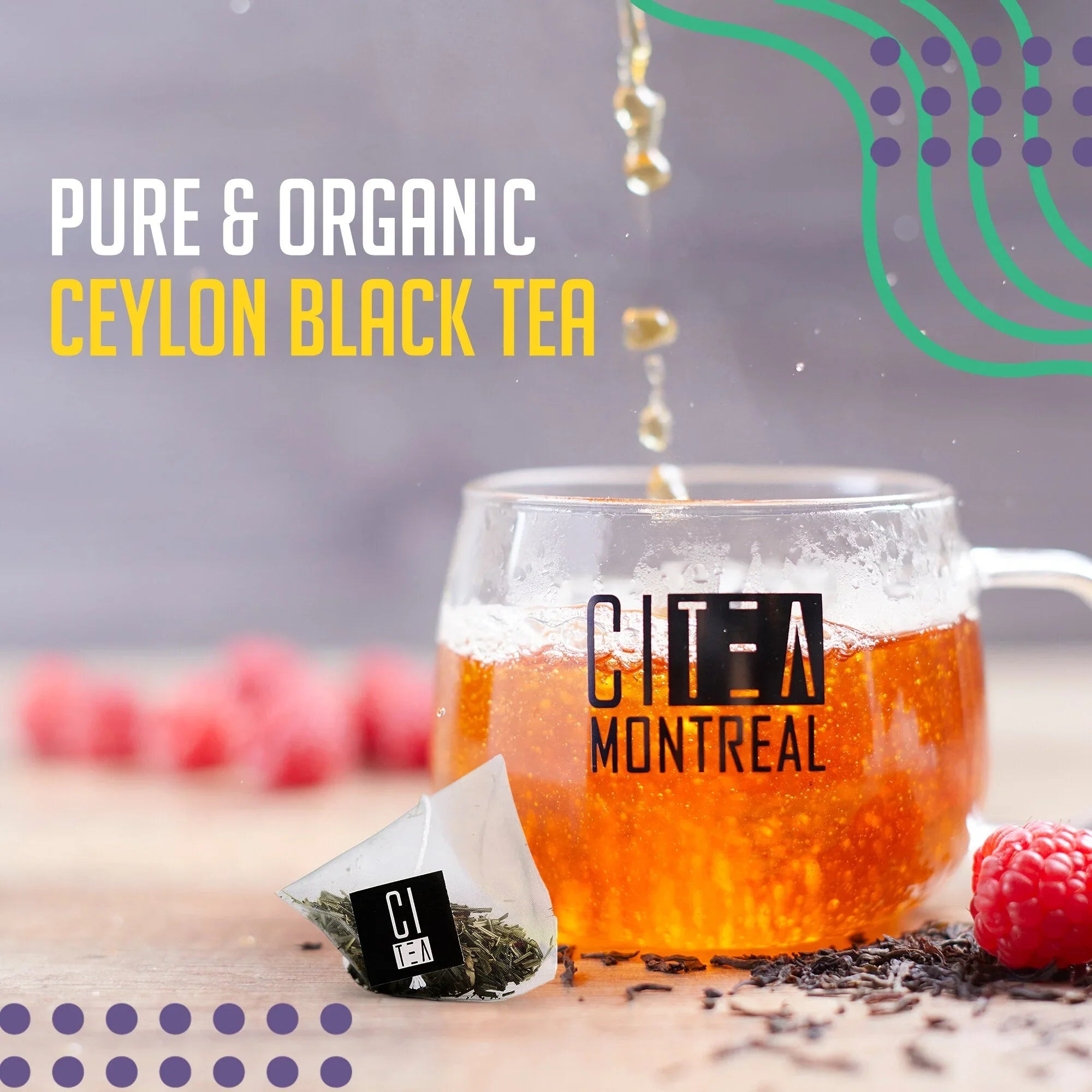 Glass cup of Ceylon black tea with tea bag and raspberries on table, CI TEA Montreal branding