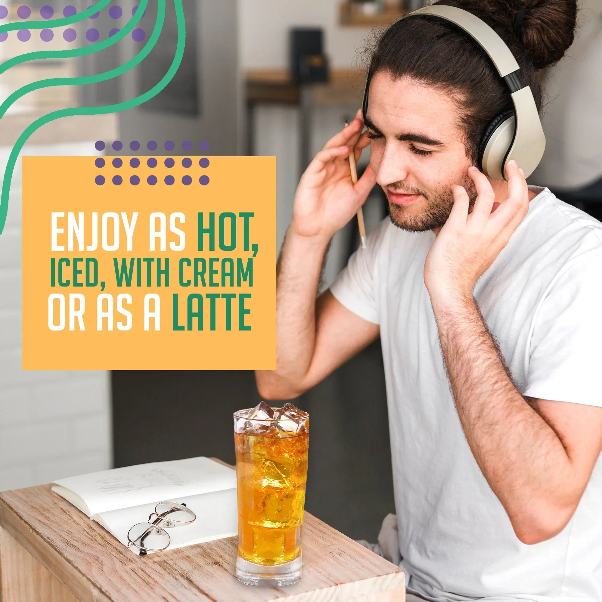 Man with headphones enjoying iced orange pekoe tea at a café table, book and glasses nearby.